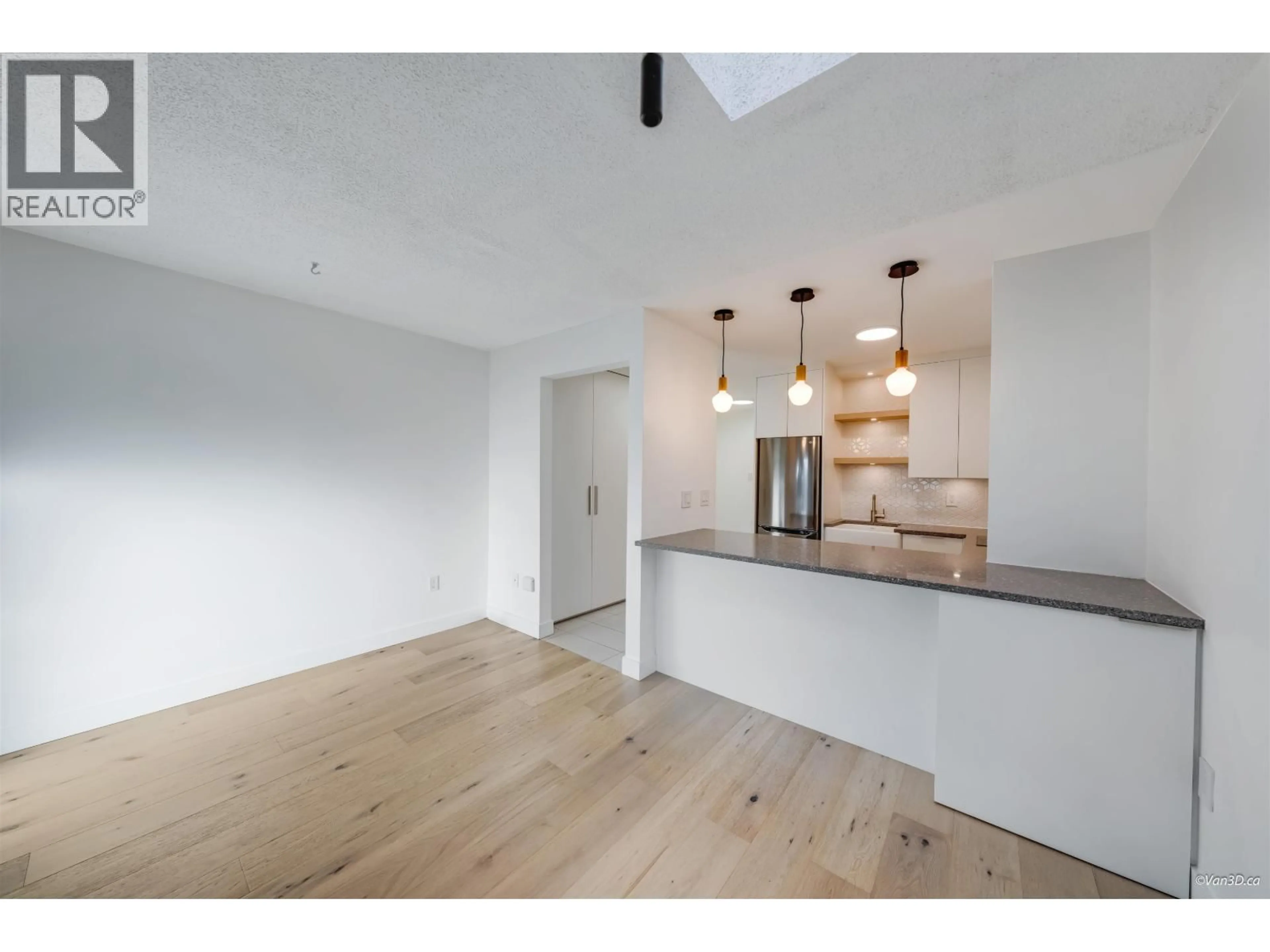 Open concept kitchen, wood/laminate floor for 303 - 1545 2ND AVENUE, Vancouver British Columbia V5N1C8