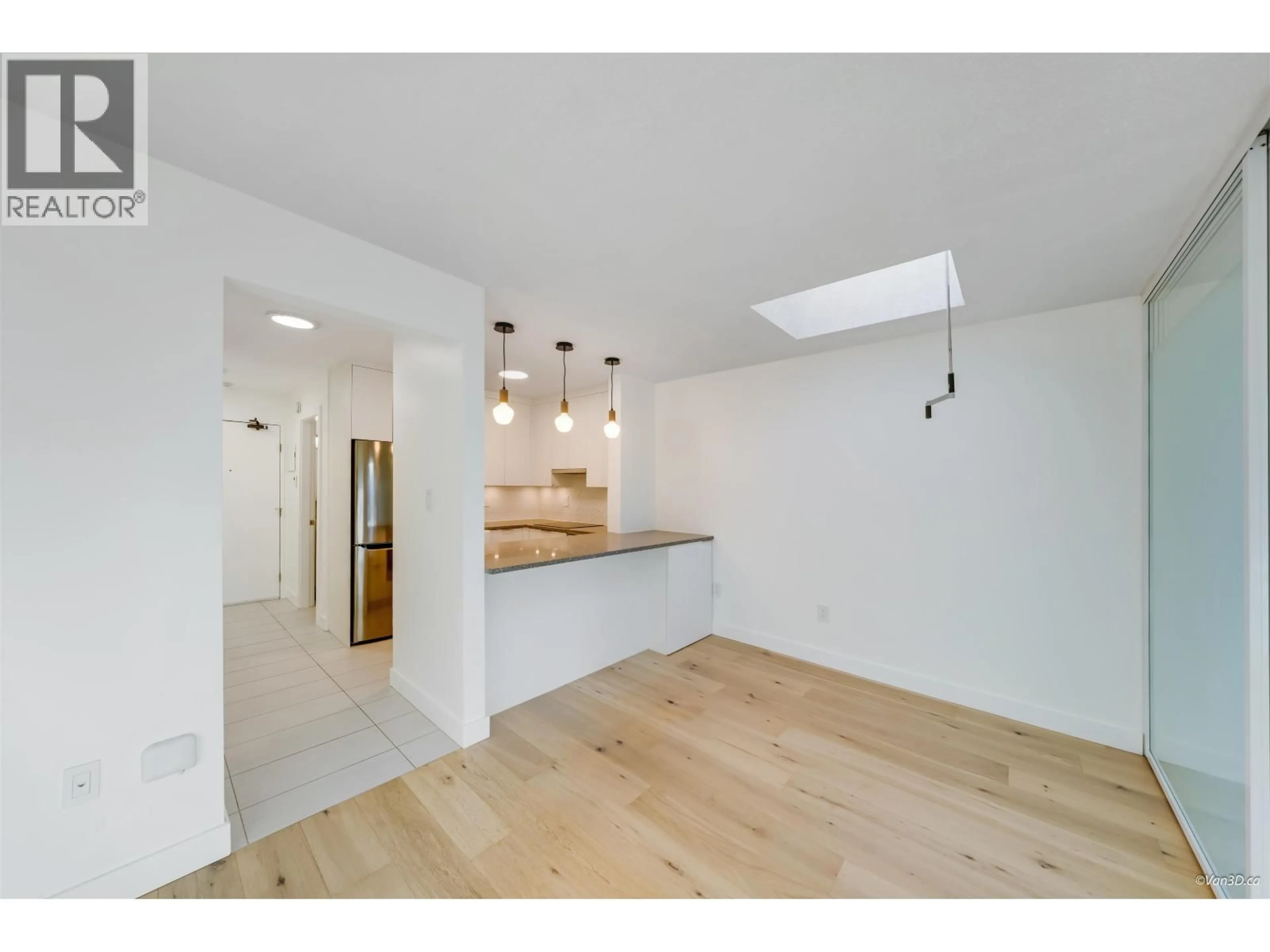 Open concept kitchen, wood/laminate floor for 303 - 1545 2ND AVENUE, Vancouver British Columbia V5N1C8