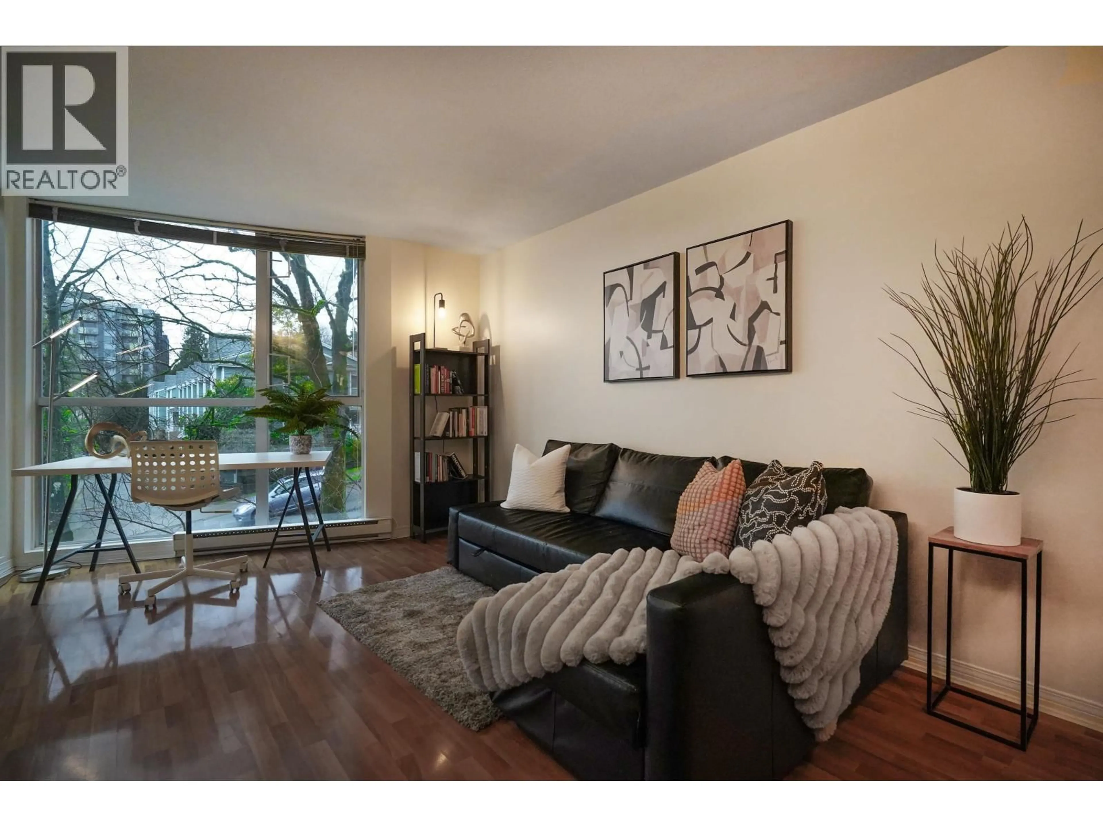 Living room with furniture, wood/laminate floor for 302 - 8420 JELLICOE STREET, Vancouver British Columbia V5S4T1