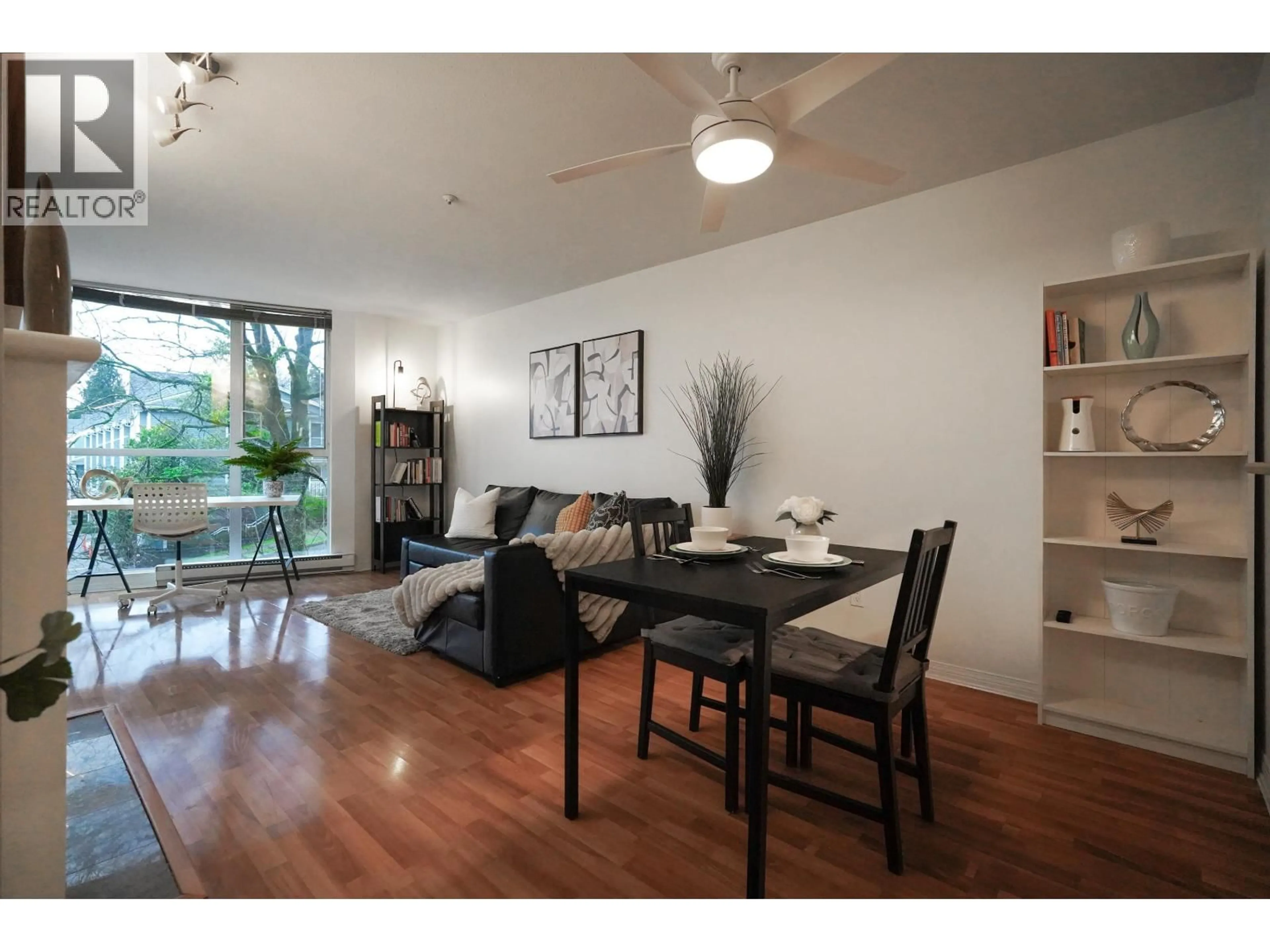 Living room with furniture, wood/laminate floor for 302 - 8420 JELLICOE STREET, Vancouver British Columbia V5S4T1