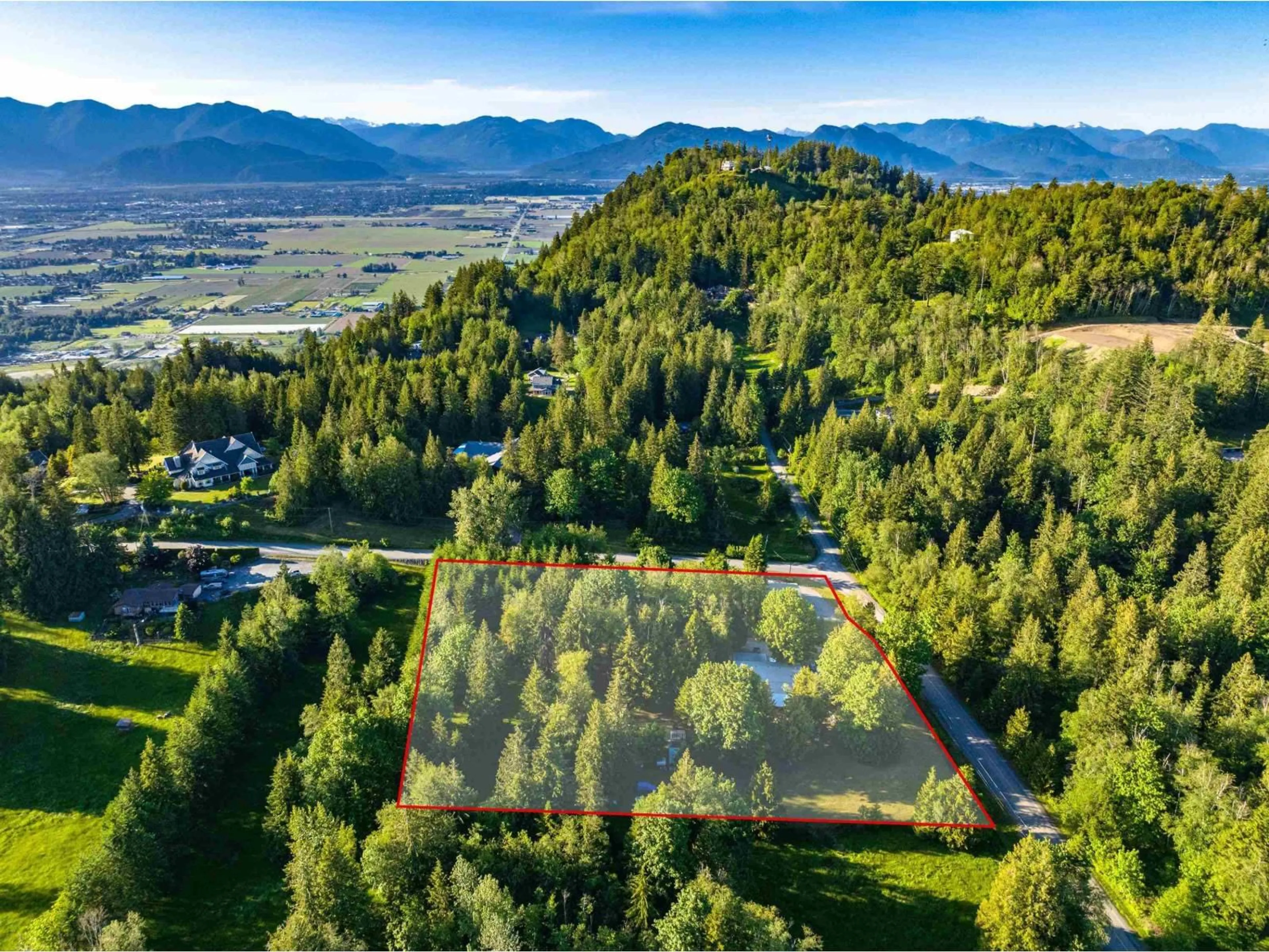 A pic from outside/outdoor area/front of a property/back of a property/a pic from drone, mountain view for 47400 EXTROM ROAD, Chilliwack British Columbia V2R4T1