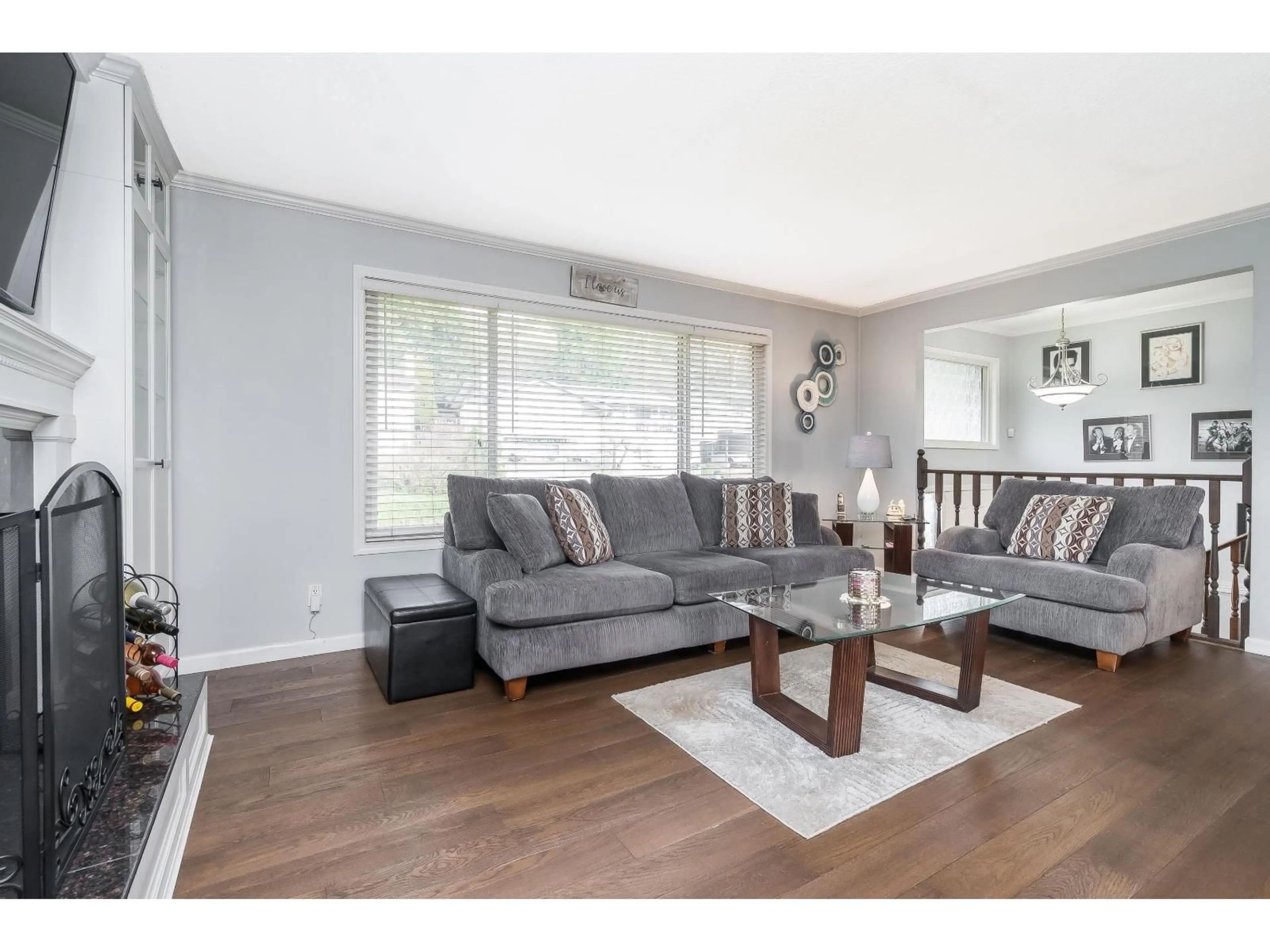 Living room with furniture, wood/laminate floor for 35104 SPENCER STREET, Abbotsford British Columbia V3G2E3