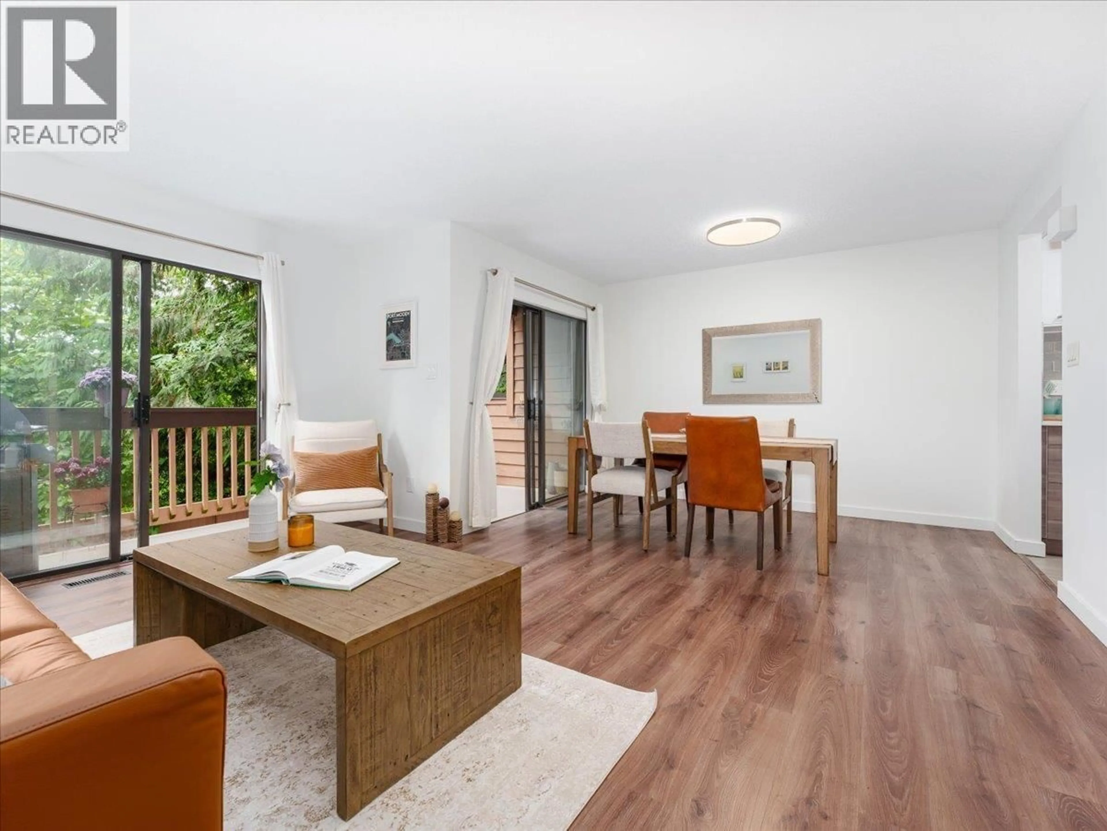 Living room with furniture, wood/laminate floor for 402 CARDIFF WAY, Port Moody British Columbia V3H3T1