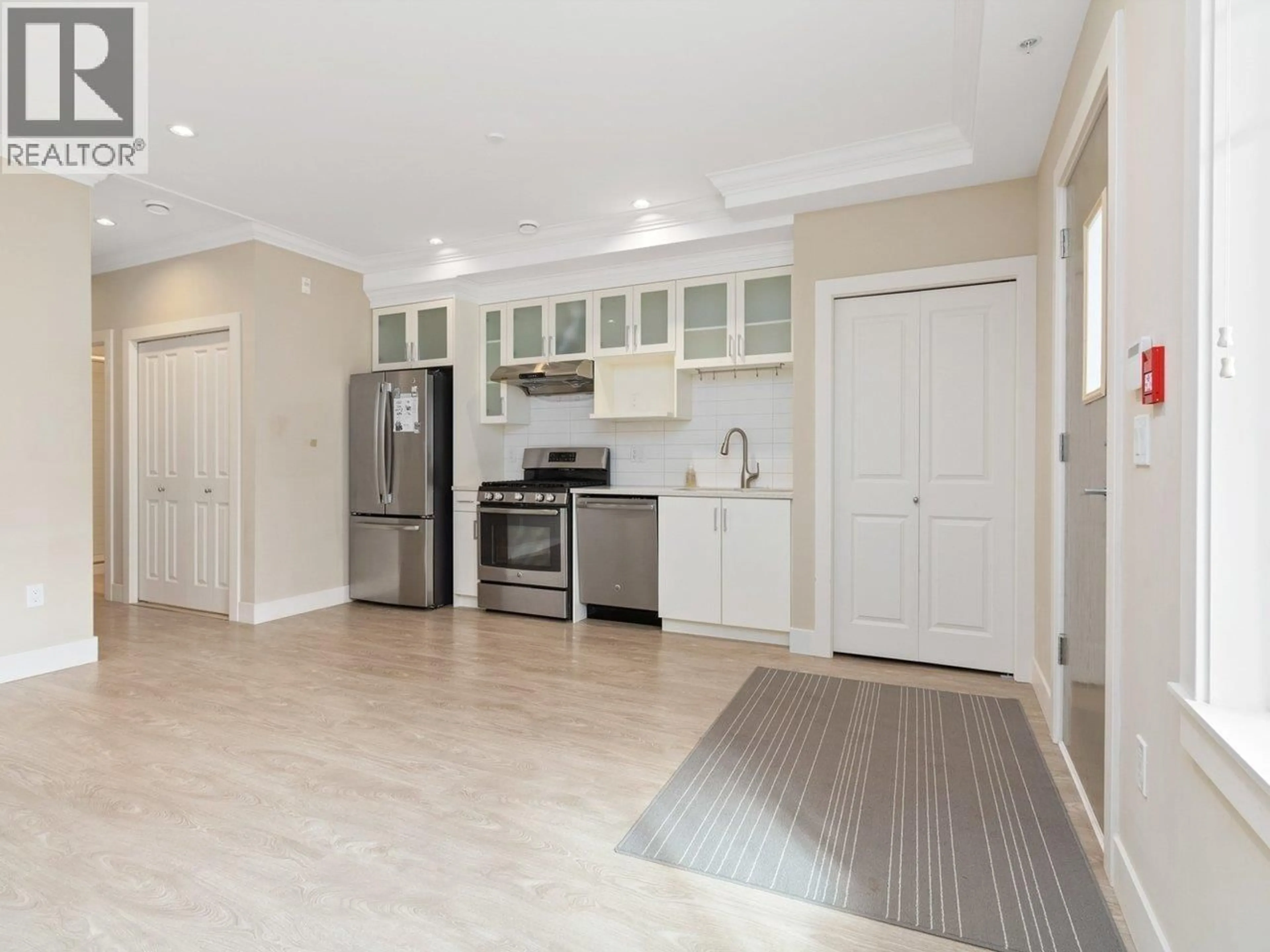 Open concept kitchen, ceramic/tile floor for 102 - 4577 SLOCAN STREET, Vancouver British Columbia V5R1Z8