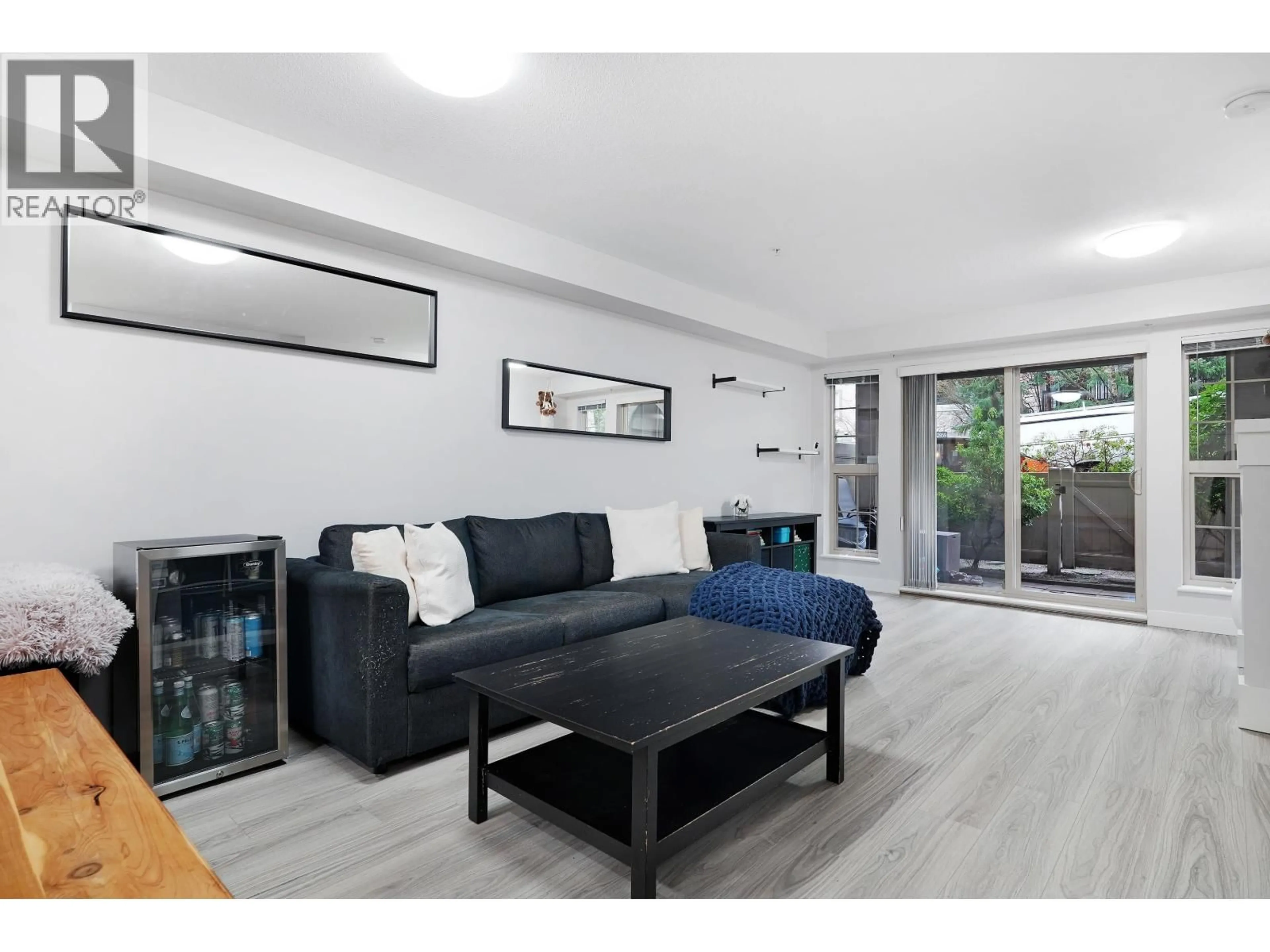 Living room with furniture, wood/laminate floor for 106 - 2968 SILVER SPRINGS BOULEVARD, Coquitlam British Columbia V3E3S2