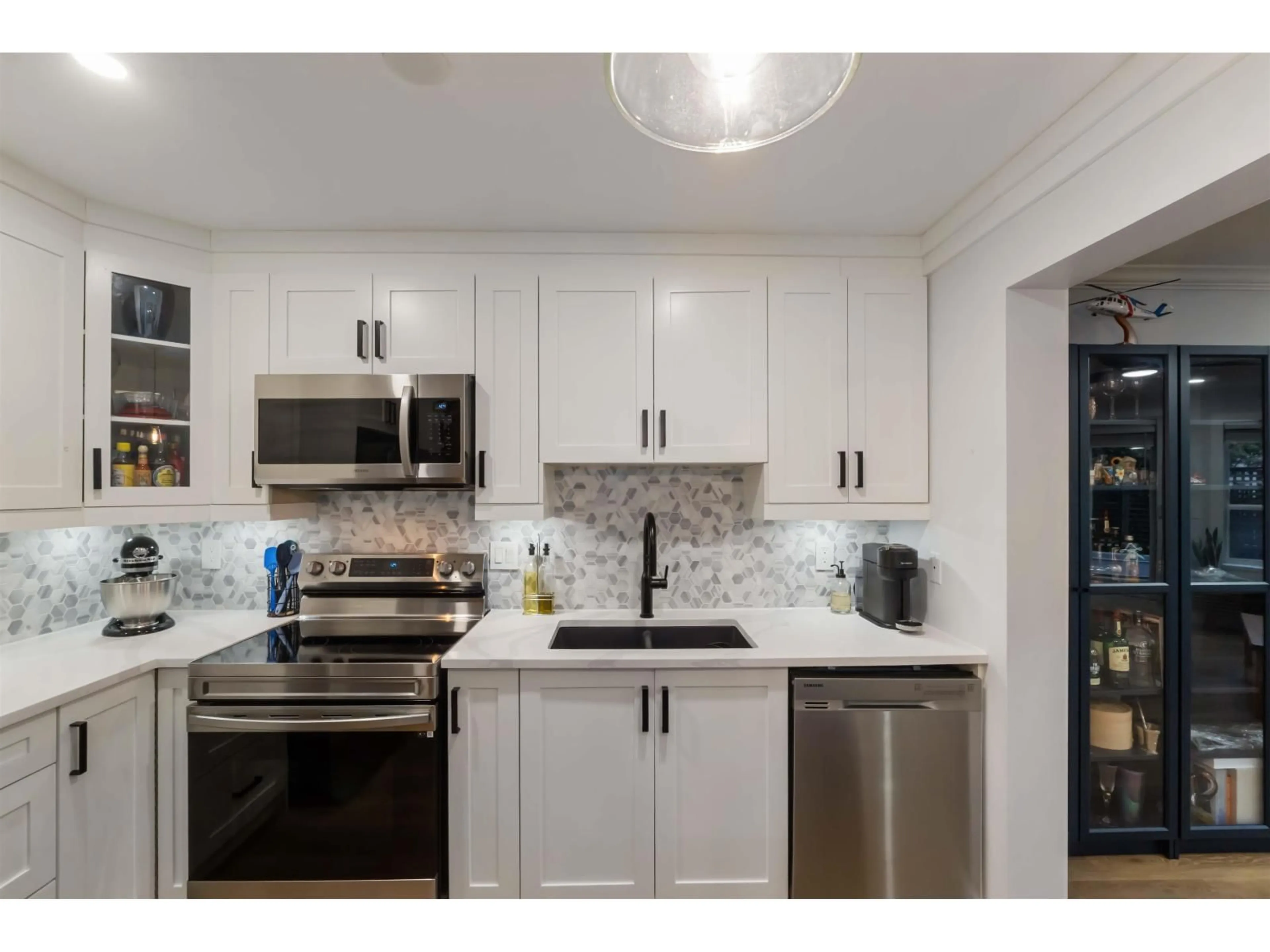 Open concept kitchen, ceramic/tile floor for 108 - 5759 GLOVER ROAD, Langley British Columbia V3A8M8