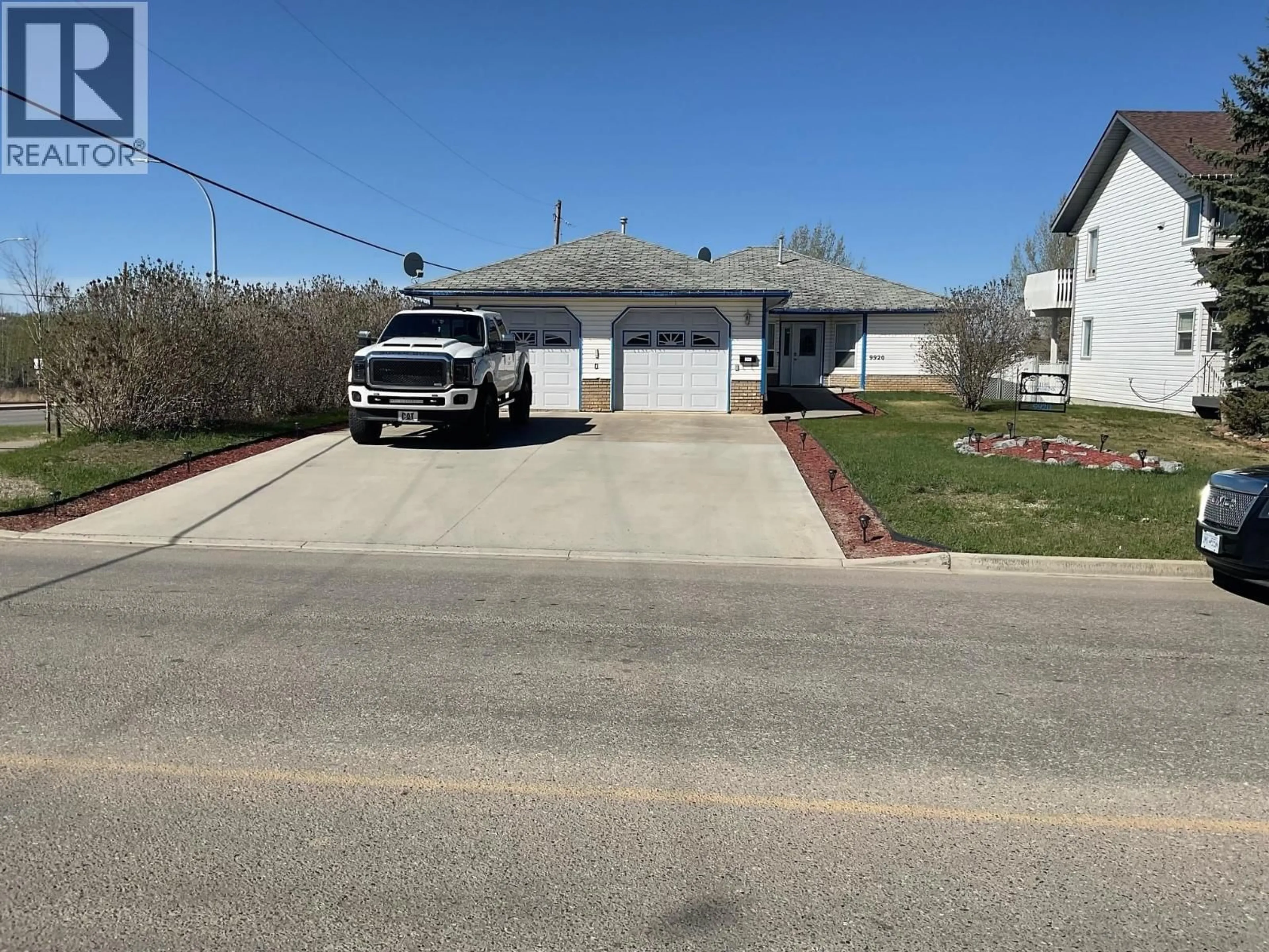 A pic from outside/outdoor area/front of a property/back of a property/a pic from drone, street for 9920 112 AVENUE, Fort St. John British Columbia V1J2W5