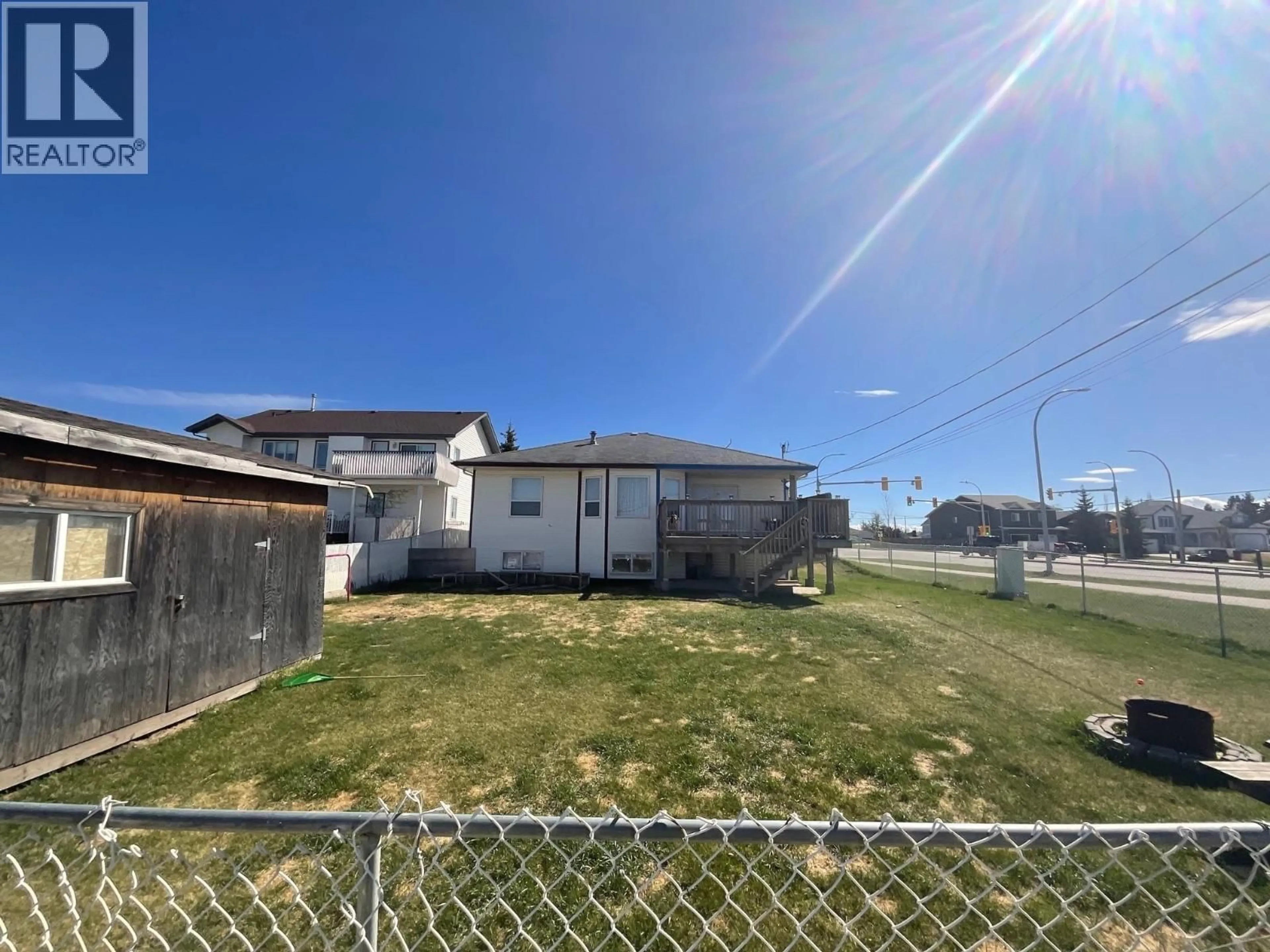 A pic from outside/outdoor area/front of a property/back of a property/a pic from drone, street for 9920 112 AVENUE, Fort St. John British Columbia V1J2W5