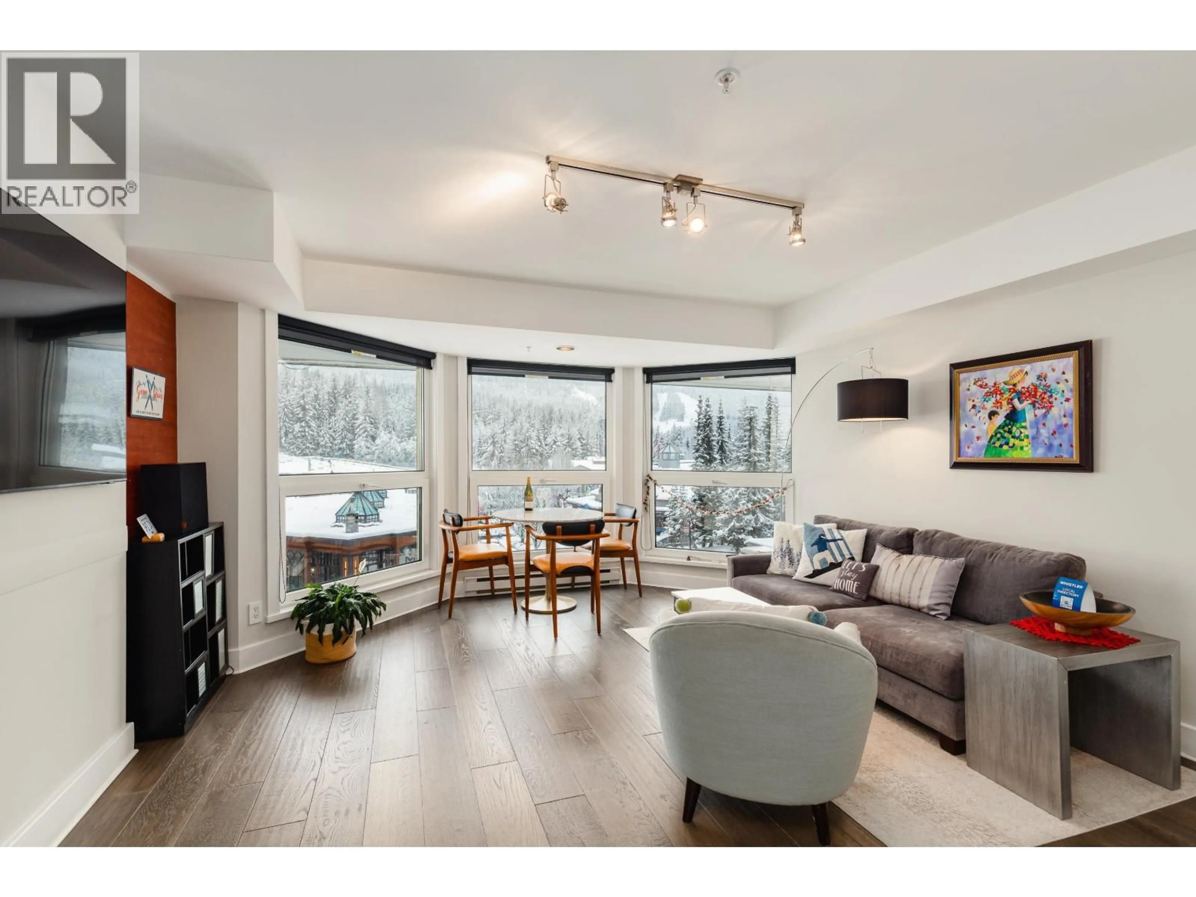 Living room with furniture, wood/laminate floor for 415 - 4557 BLACKCOMB WAY, Whistler British Columbia V8E0Y2