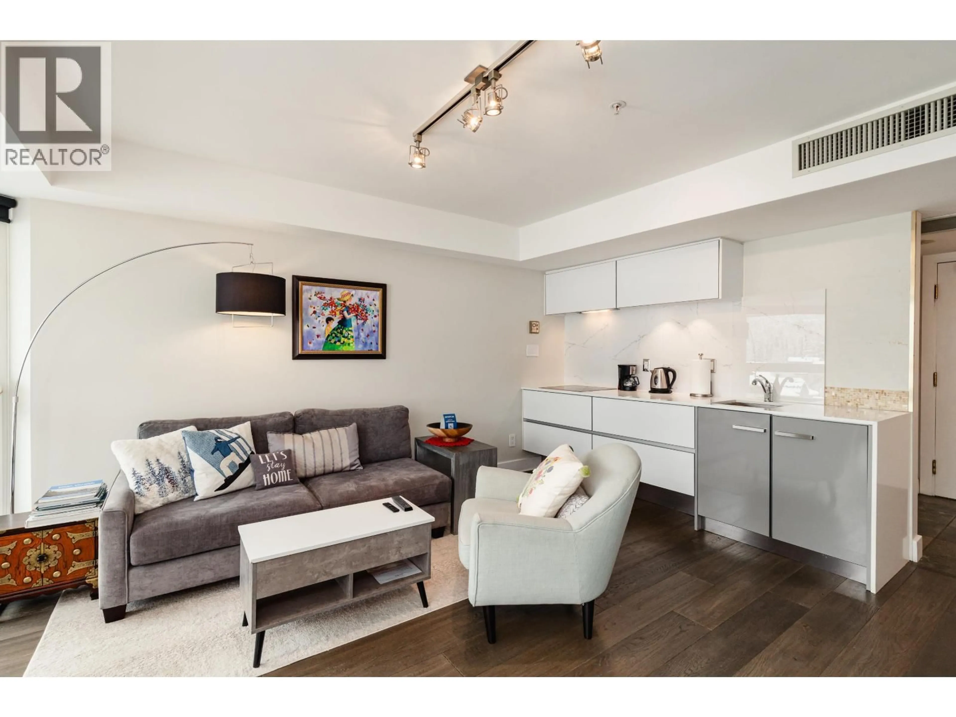 Living room with furniture, wood/laminate floor for 415 - 4557 BLACKCOMB WAY, Whistler British Columbia V8E0Y2