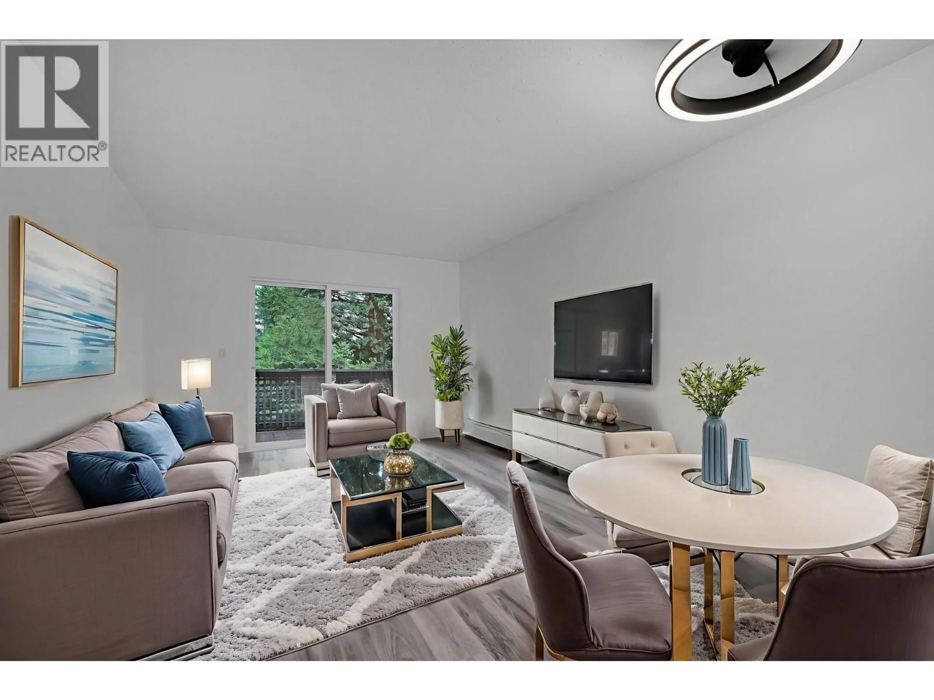 Living room with furniture, wood/laminate floor for 157 - 200 WESTHILL PLACE, Port Moody British Columbia V3H1V2