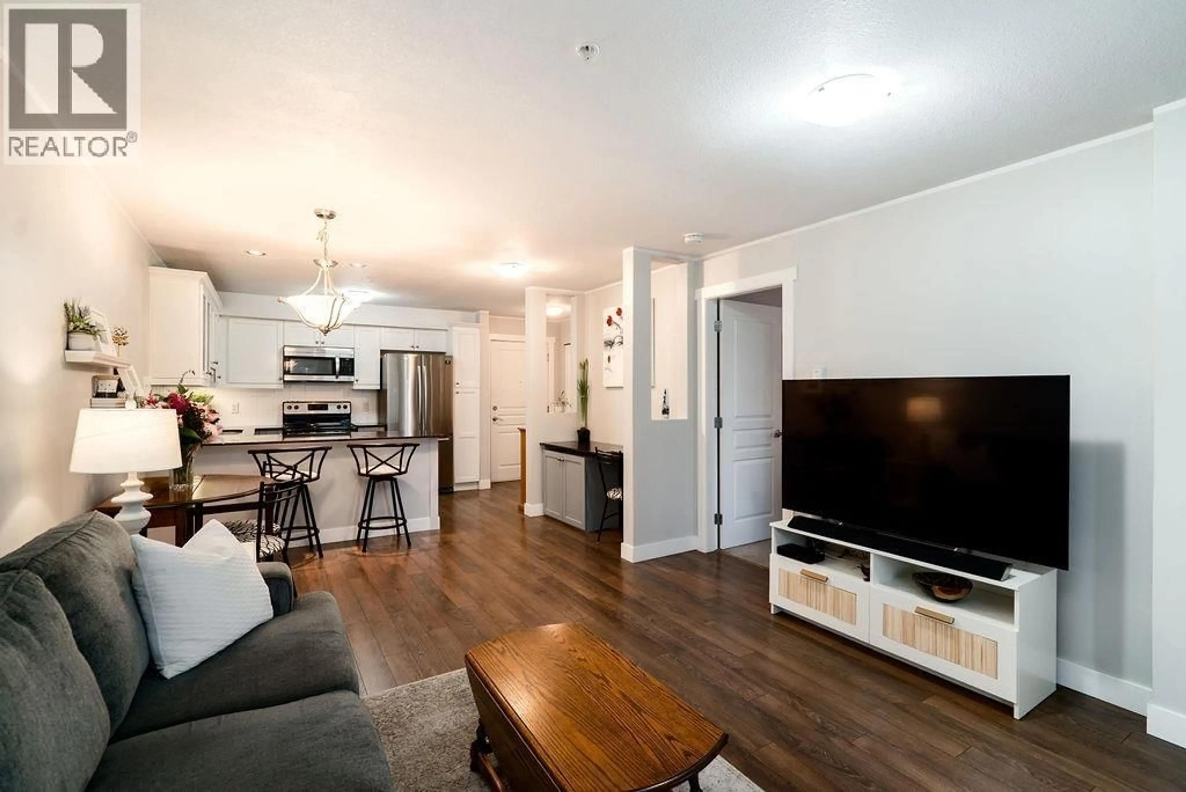 Living room with furniture, wood/laminate floor for 111 - 1969 WESTMINSTER AVENUE, Port Coquitlam British Columbia V3B1E7