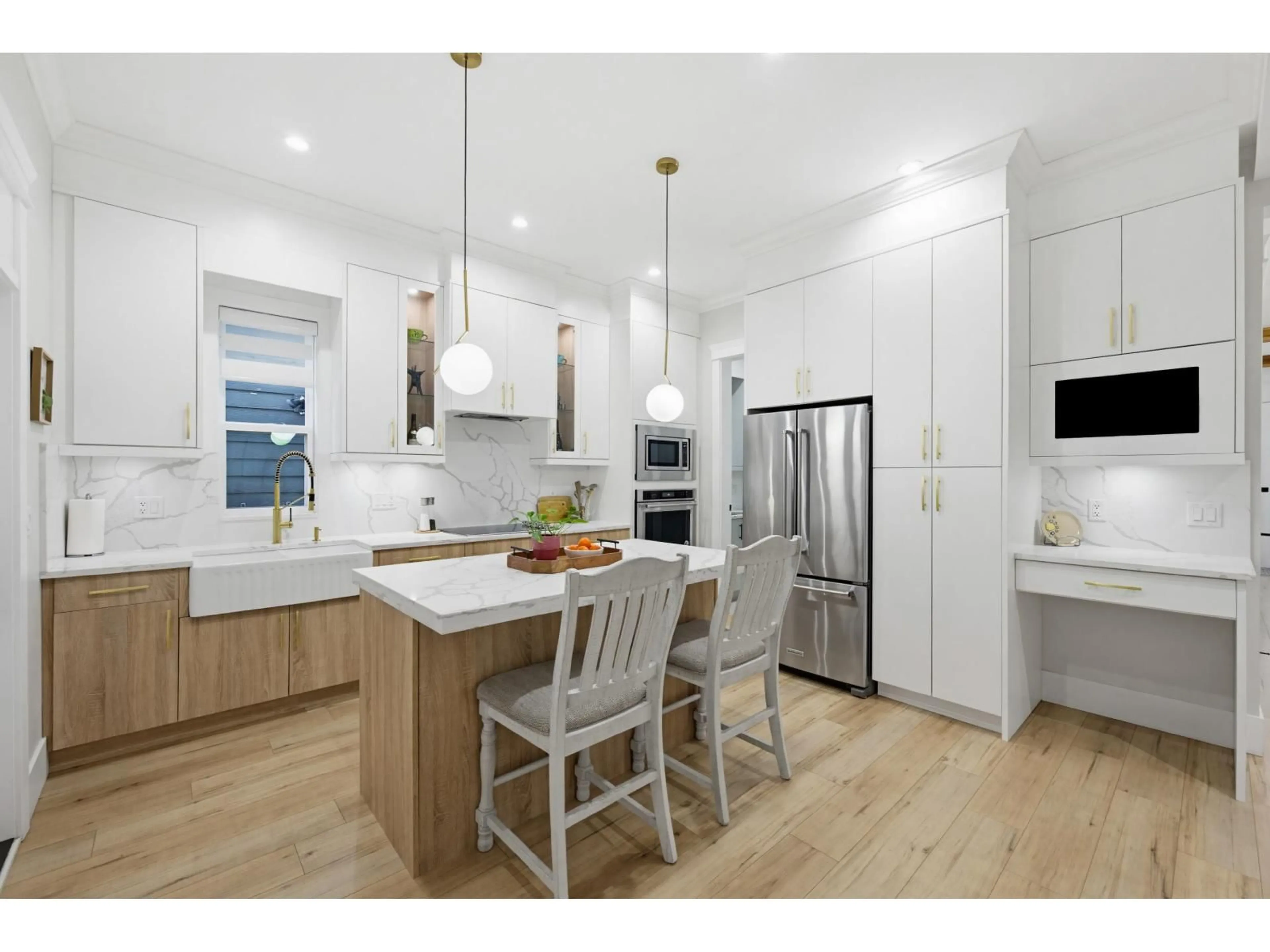 Open concept kitchen, wood/laminate floor for 7115 206 STREET, Langley British Columbia V2Y3J9