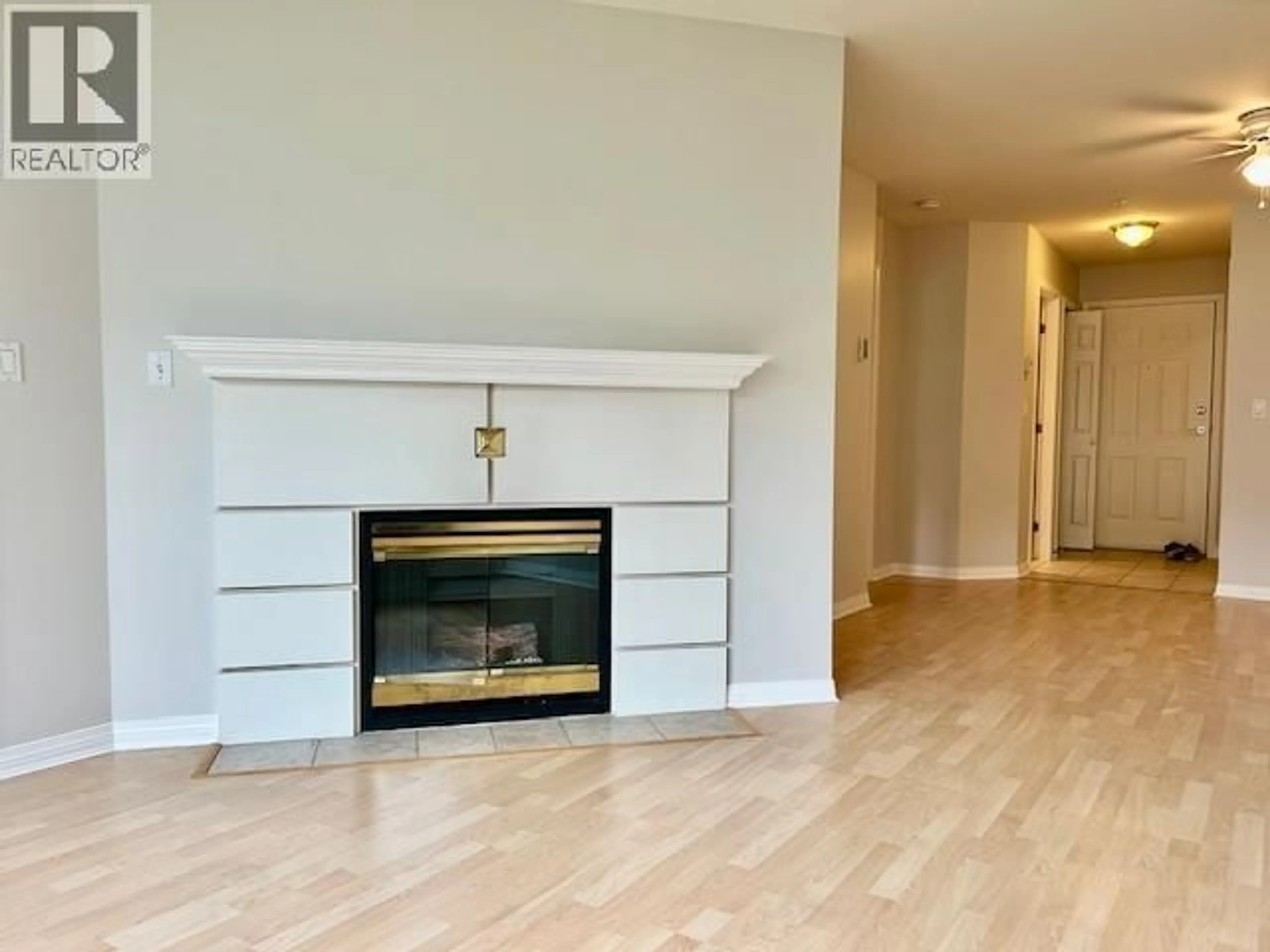 Living room with furniture, wood/laminate floor for 210 - 12911 RAILWAY AVENUE, Richmond British Columbia V7E6L8