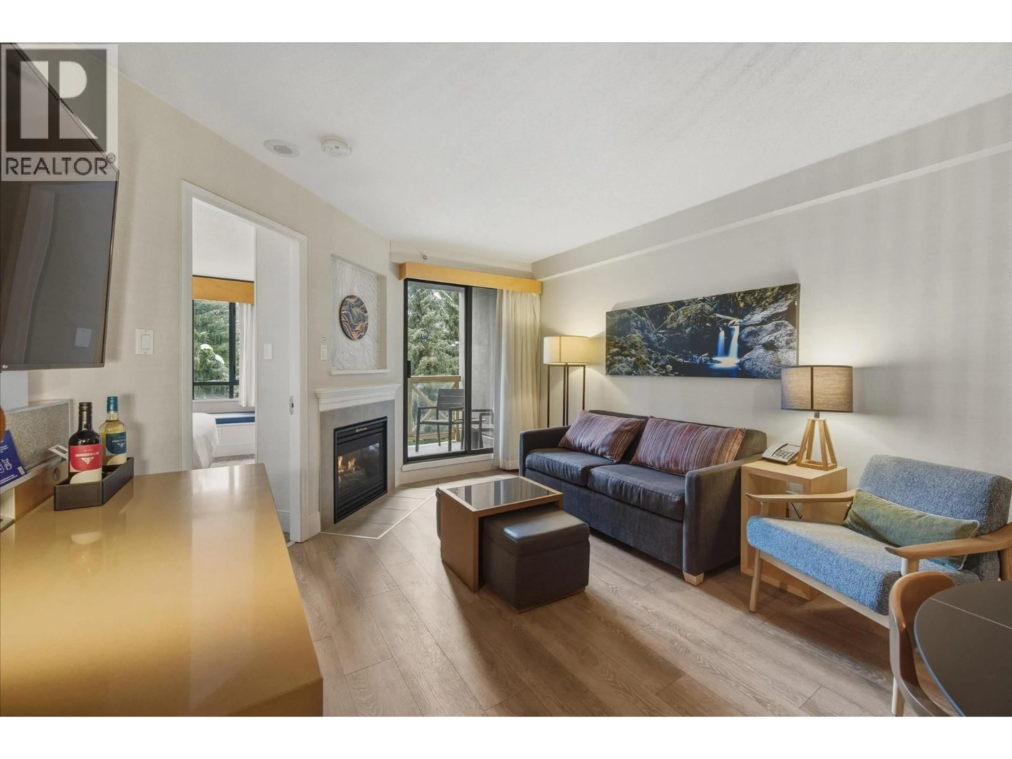 Living room with furniture, wood/laminate floor for 1409 - 4308 MAIN STREET, Whistler British Columbia V8E1A9