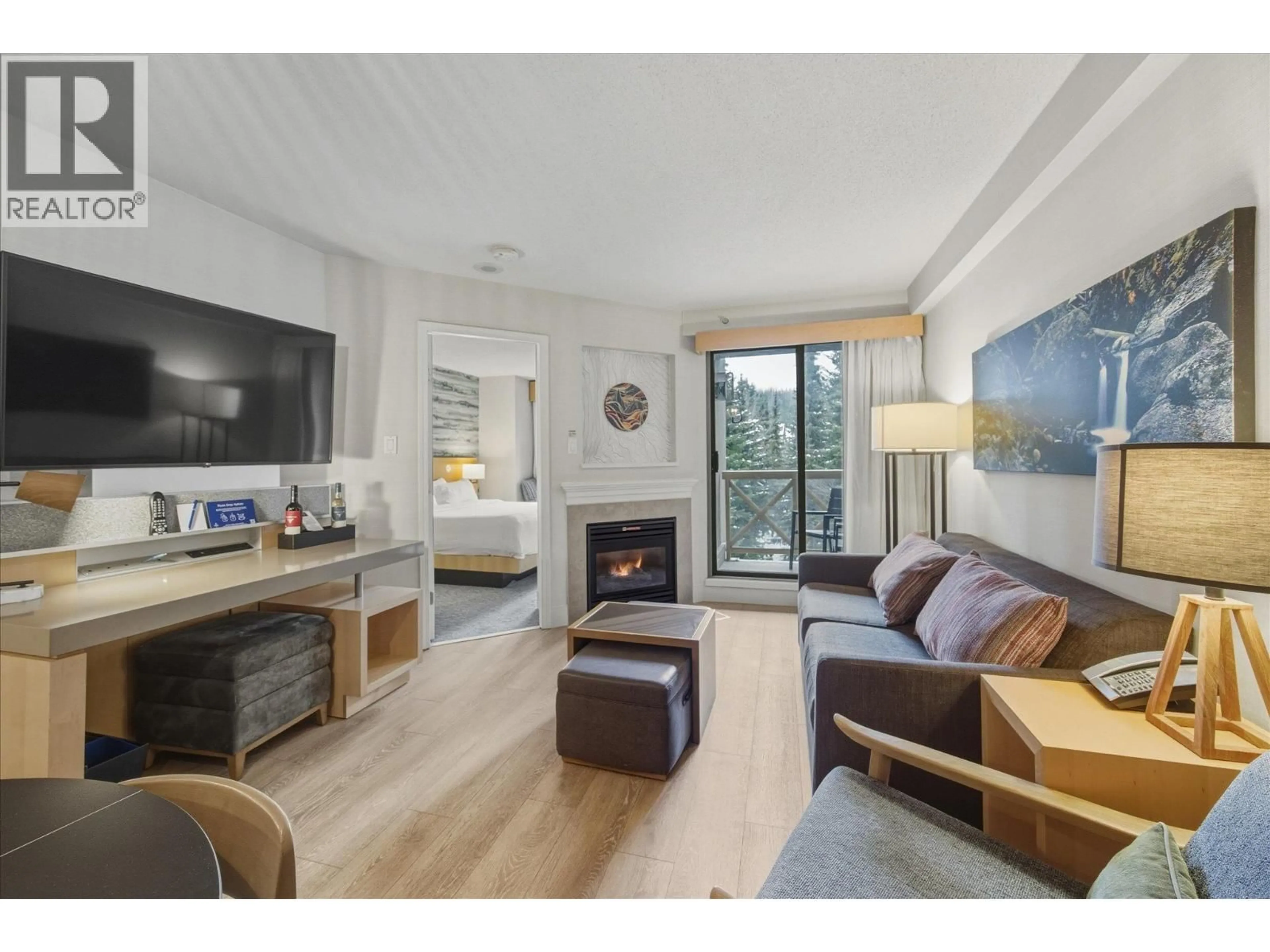 Living room with furniture, wood/laminate floor for 1409 - 4308 MAIN STREET, Whistler British Columbia V8E1A9