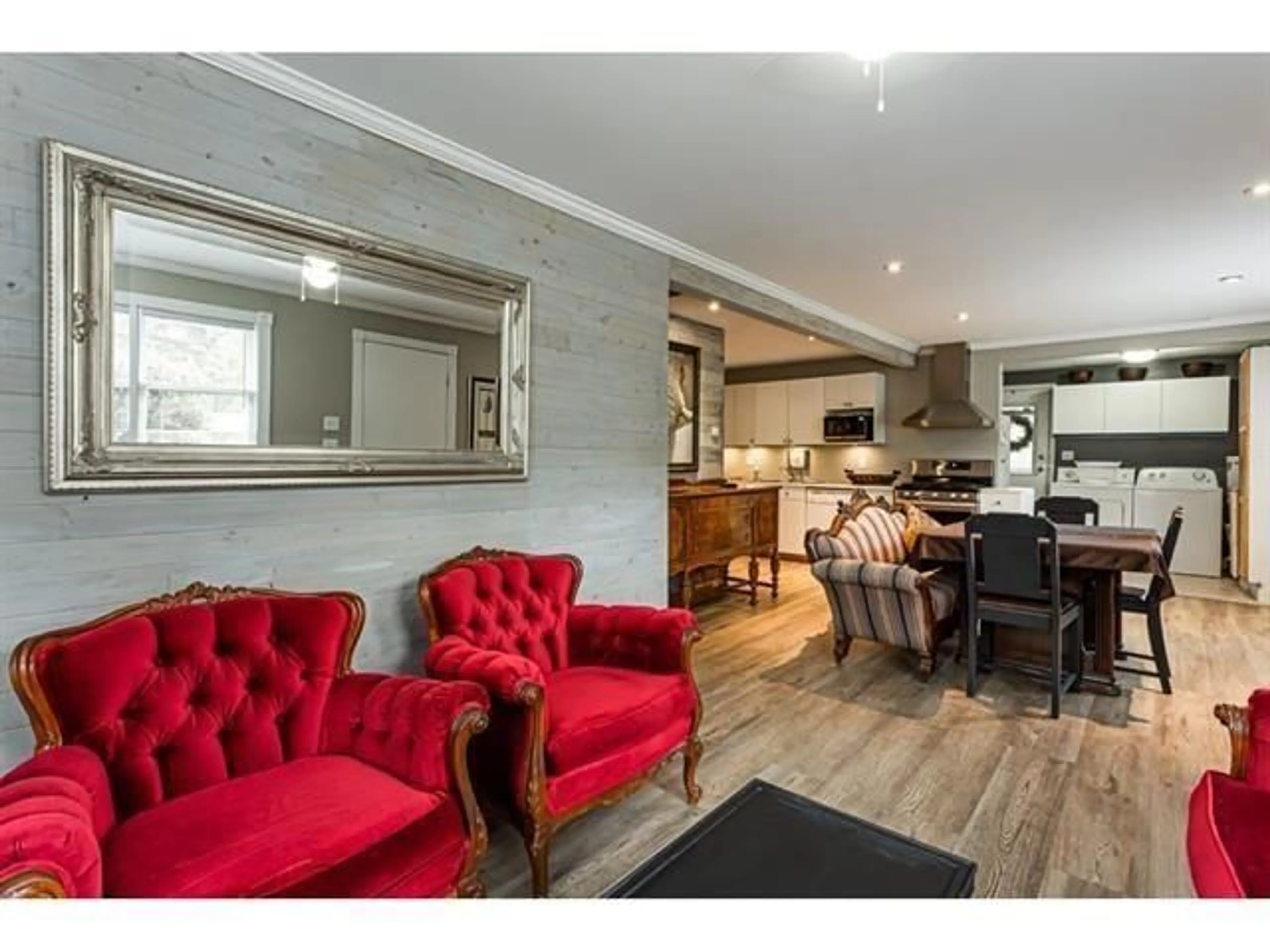 Living room with furniture, wood/laminate floor for 5881 176A STREET, Surrey British Columbia V3S4H6