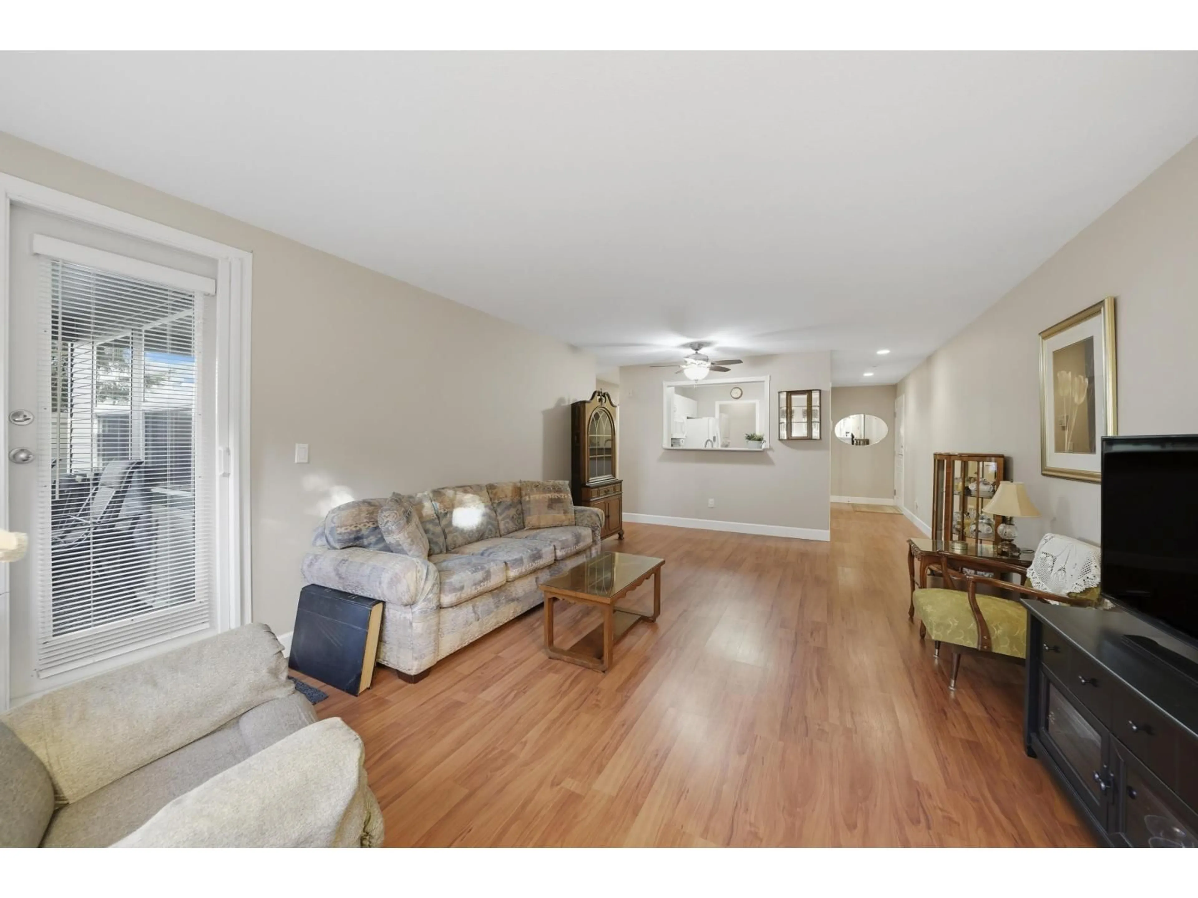 Living room with furniture, wood/laminate floor for 105 - 6385 121 STREET, Surrey British Columbia V3X3K6