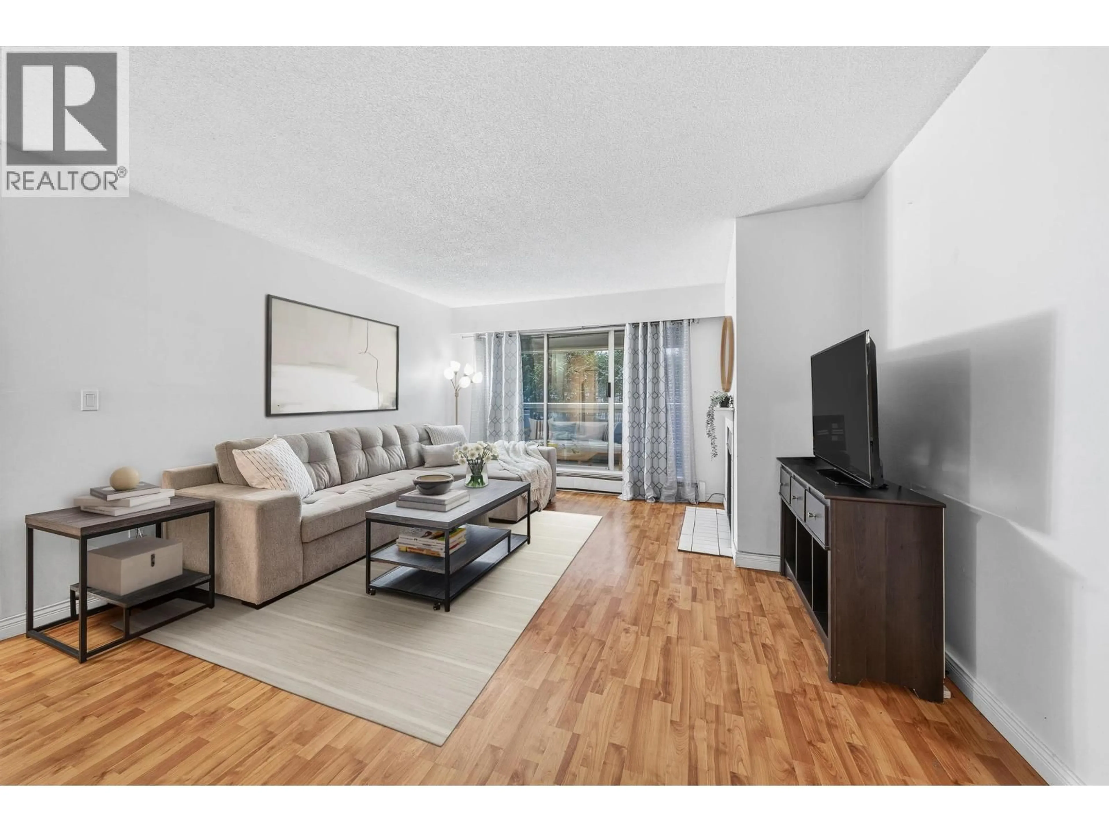 Living room with furniture, wood/laminate floor for 105 - 932 ROBINSON STREET, Coquitlam British Columbia V3J7R8