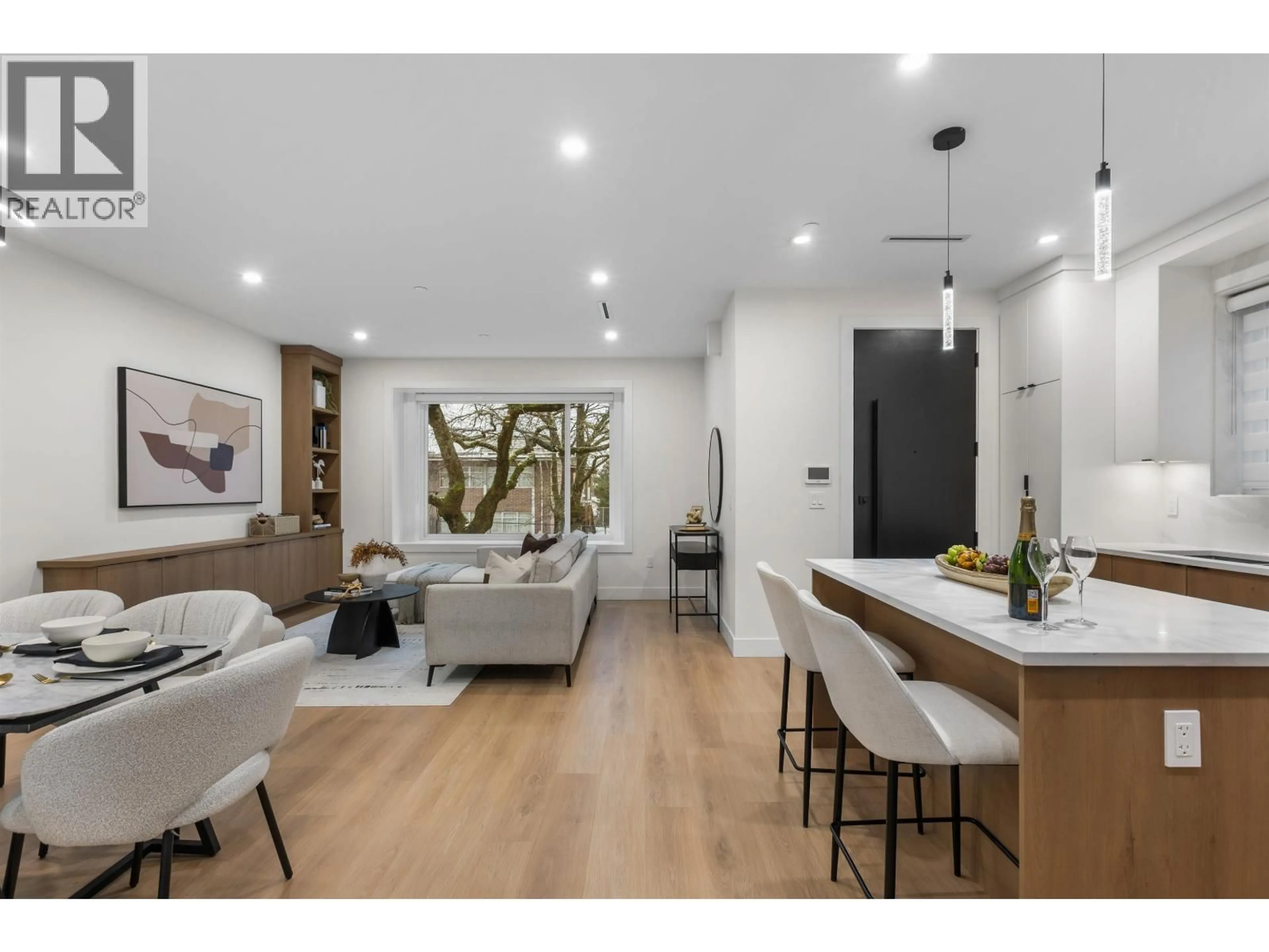 Open concept kitchen, wood/laminate floor for 1 - 435 47TH AVENUE, Vancouver British Columbia V5W2B3