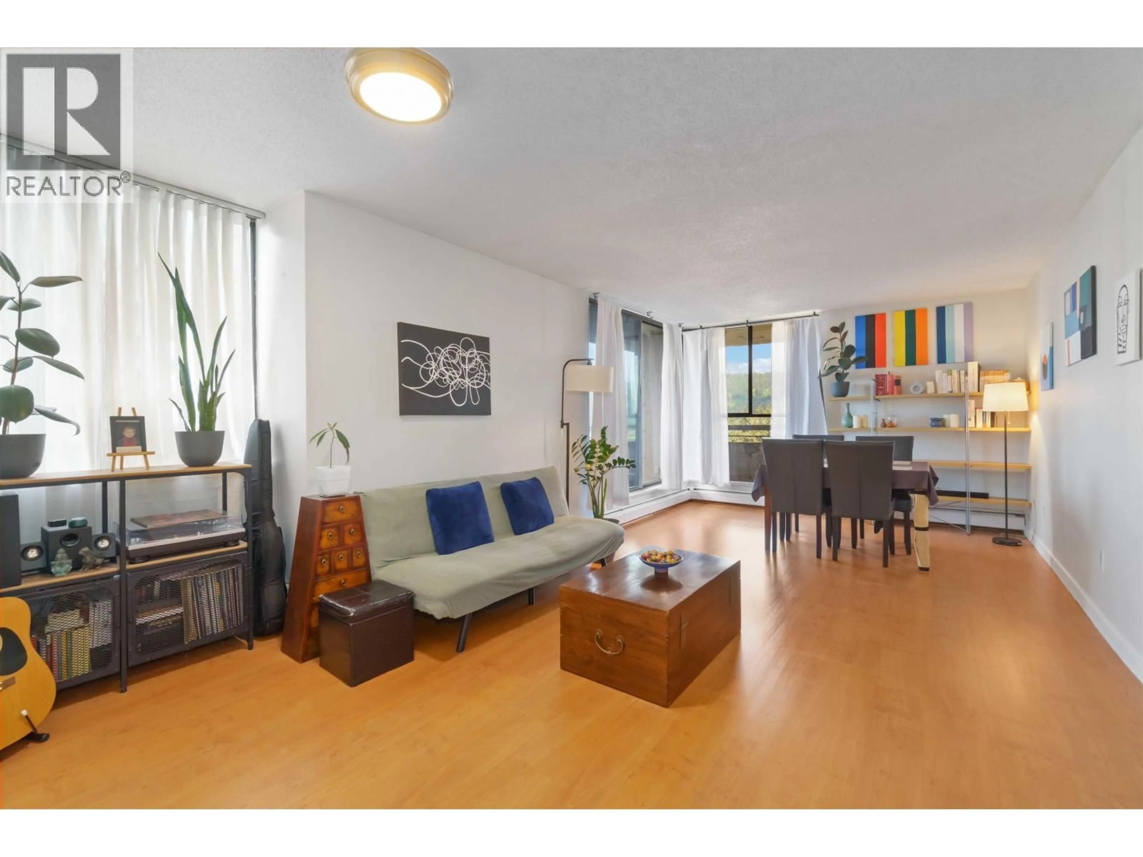 Living room with furniture, wood/laminate floor for 2002 - 3755 BARTLETT COURT, Burnaby British Columbia V3J7G7