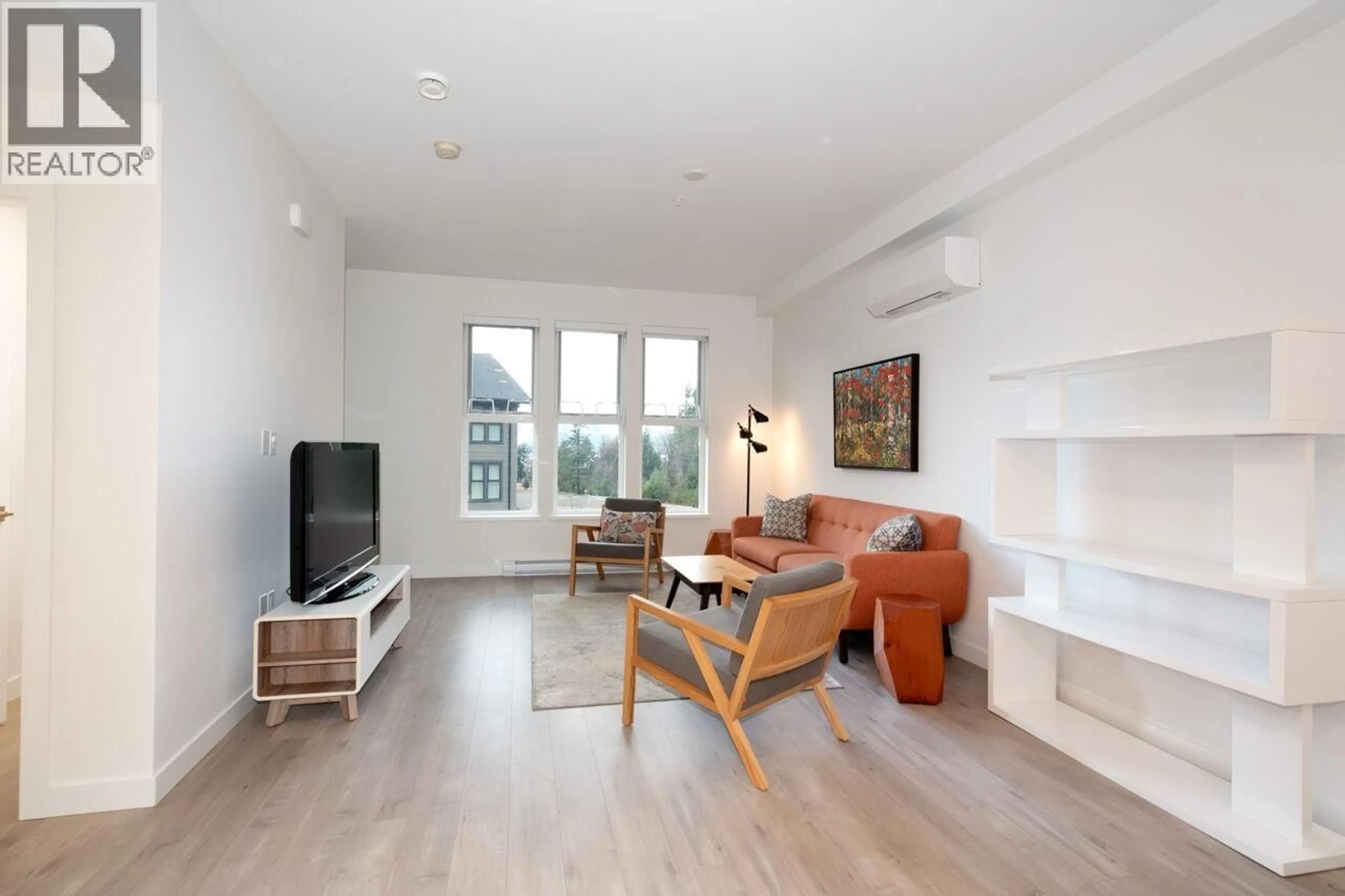 Living room with furniture, wood/laminate floor for 65 - 351 COPPER DRIVE, Britannia Beach British Columbia V8B1C5