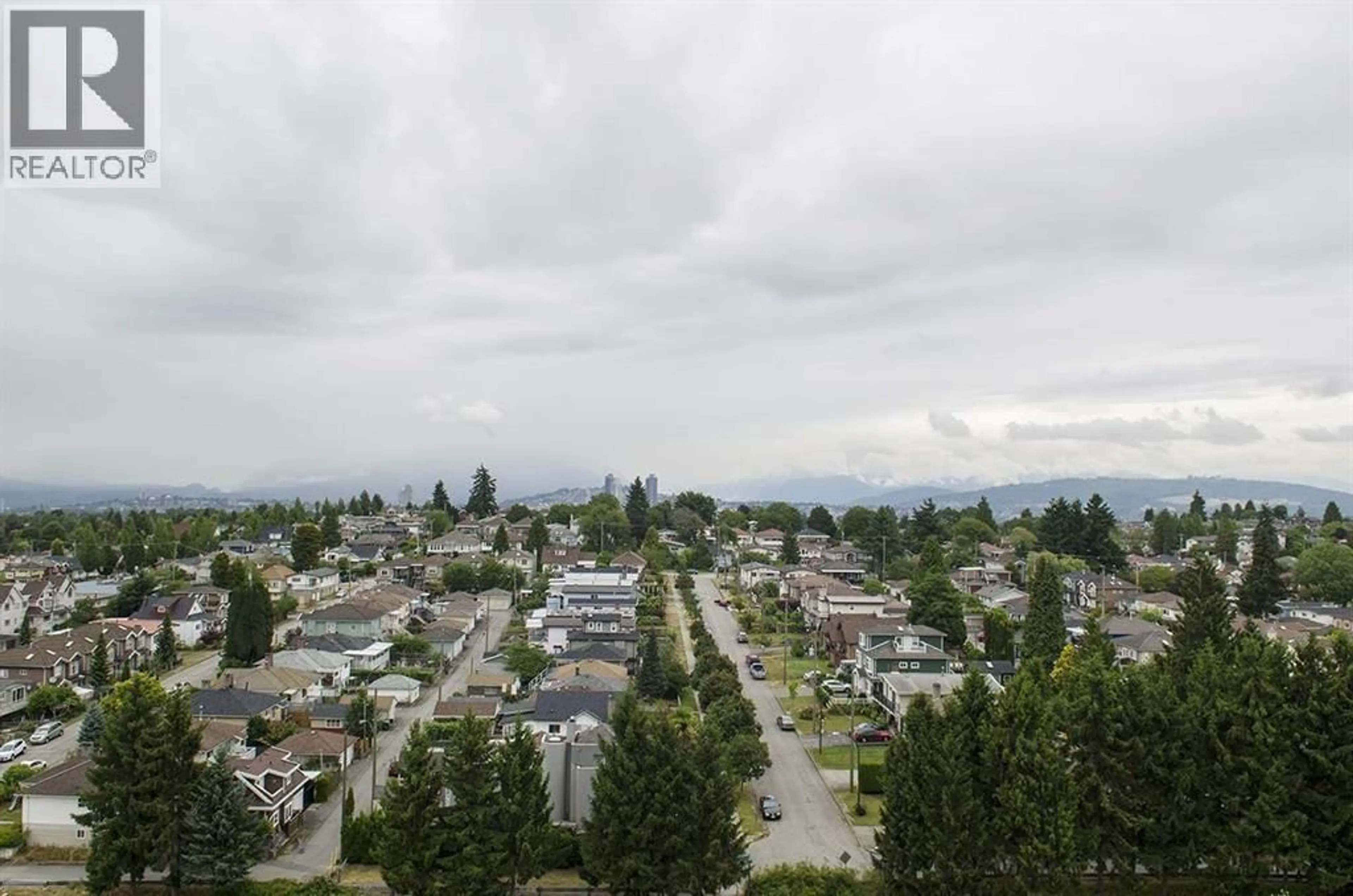 A pic from outside/outdoor area/front of a property/back of a property/a pic from drone, mountain view for 1408 - 5189 GASTON STREET, Vancouver British Columbia V5R6C7