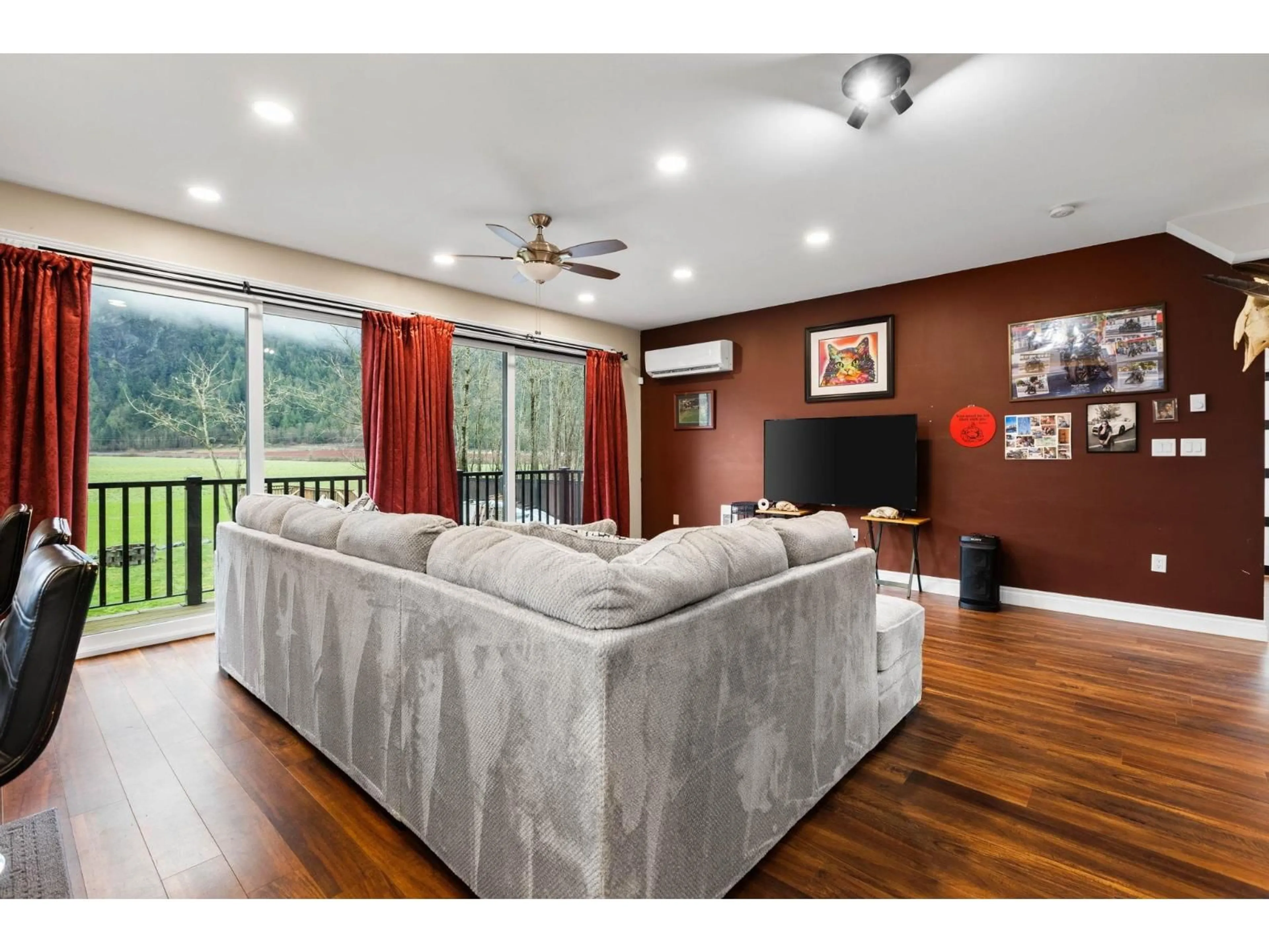 Living room with furniture, wood/laminate floor for 58560 TRANS CANADA HIGHWAY, Laidlaw British Columbia V0X1L2