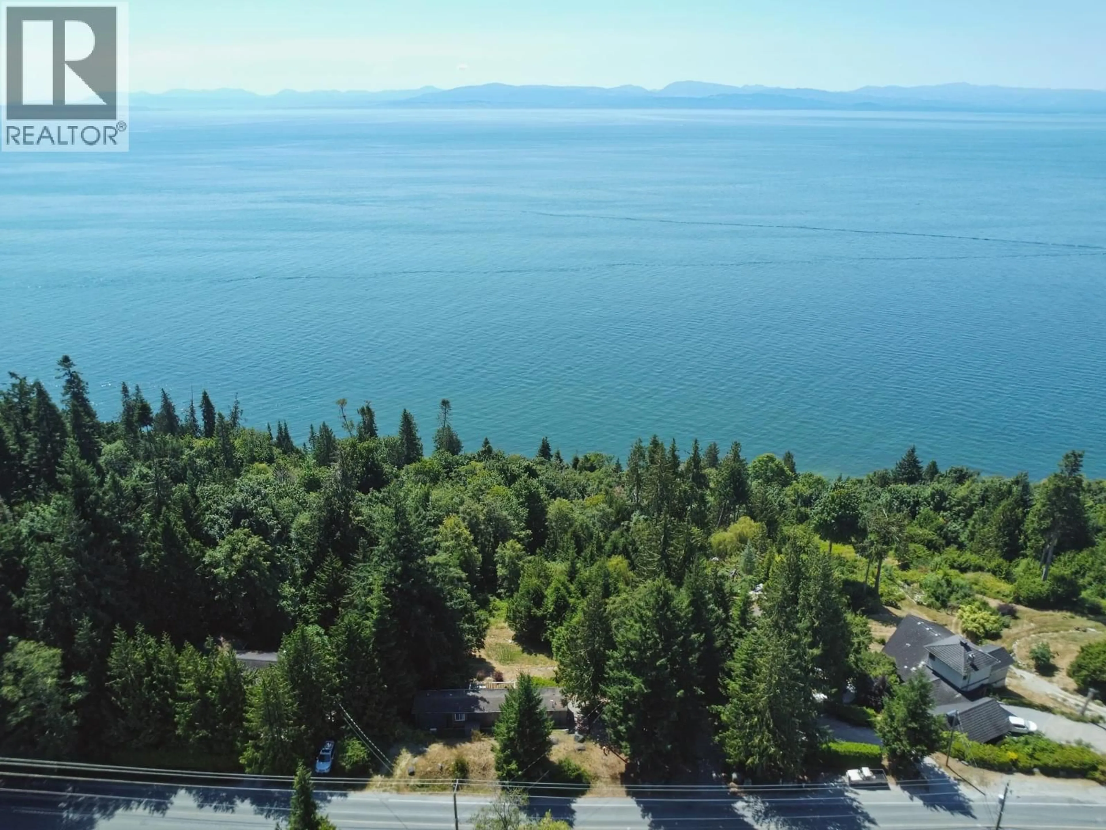 A pic from outside/outdoor area/front of a property/back of a property/a pic from drone, water/lake/river/ocean view for 7949 REDROOFFS ROAD, Halfmoon Bay British Columbia V7Z1C6