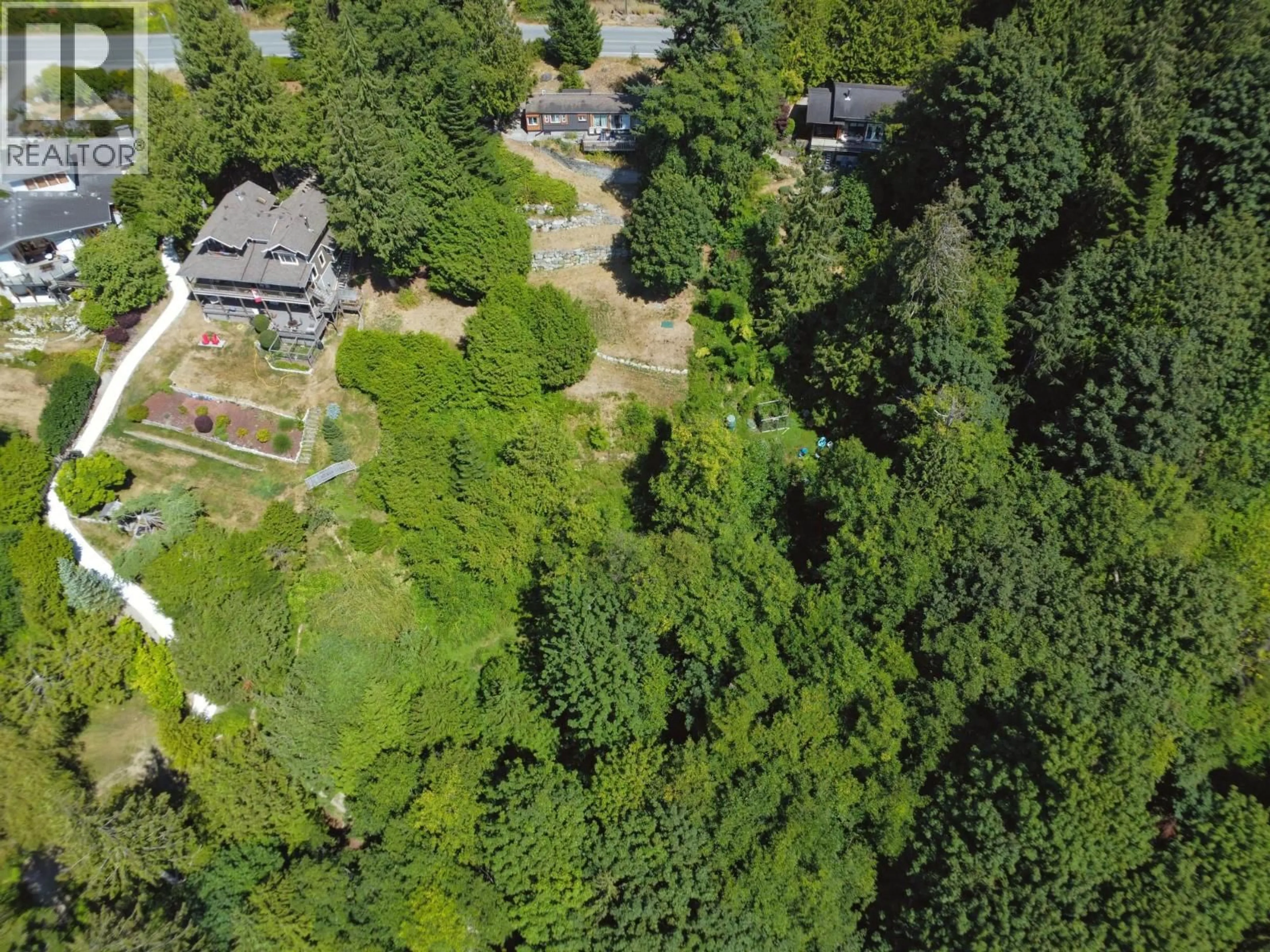 A pic from outside/outdoor area/front of a property/back of a property/a pic from drone, forest/trees view for 7949 REDROOFFS ROAD, Halfmoon Bay British Columbia V7Z1C6