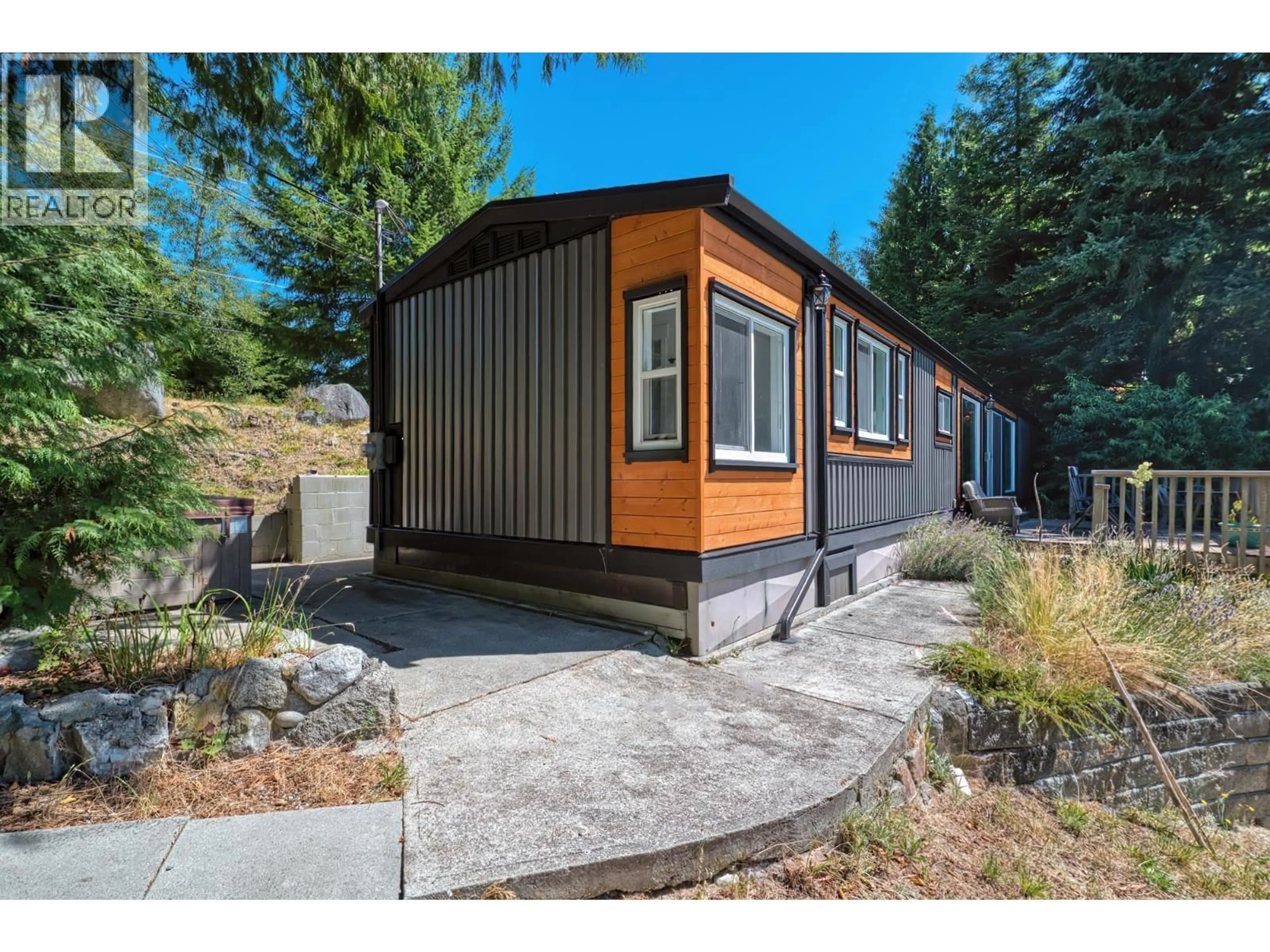 Home with vinyl exterior material, street for 7949 REDROOFFS ROAD, Halfmoon Bay British Columbia V7Z1C6