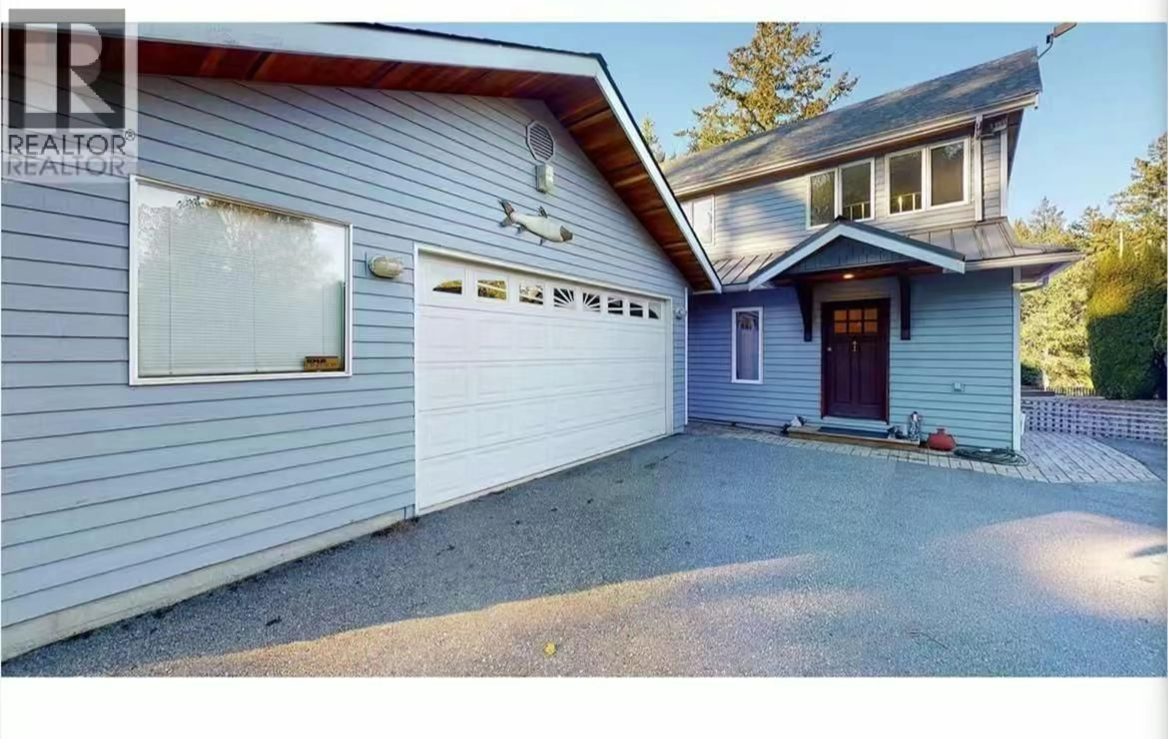 Home with vinyl exterior material, street for 5393 SANS SOUCI ROAD, Halfmoon Bay British Columbia V7Z1B6