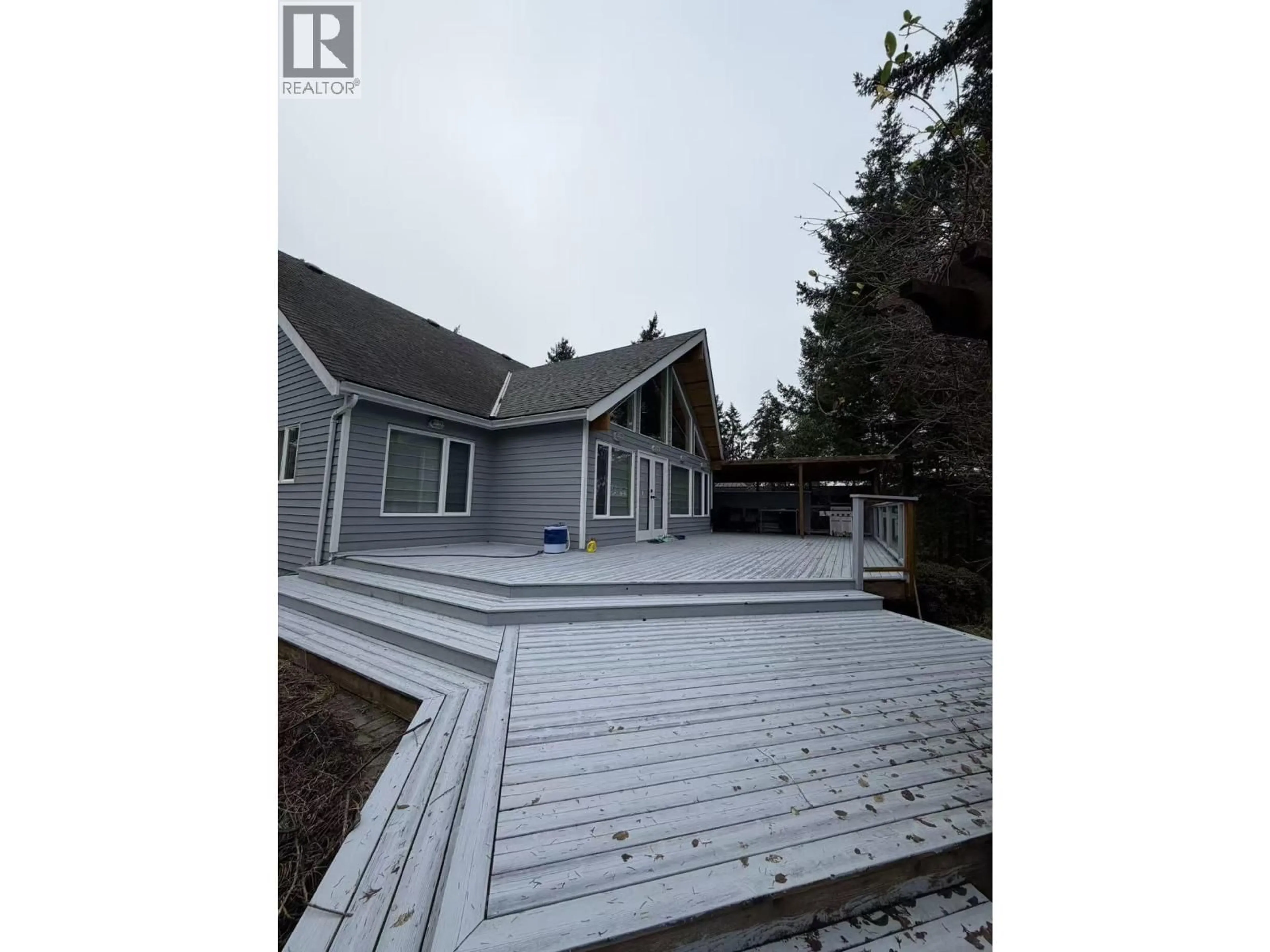 A pic from outside/outdoor area/front of a property/back of a property/a pic from drone, water/lake/river/ocean view for 5393 SANS SOUCI ROAD, Halfmoon Bay British Columbia V7Z1B6