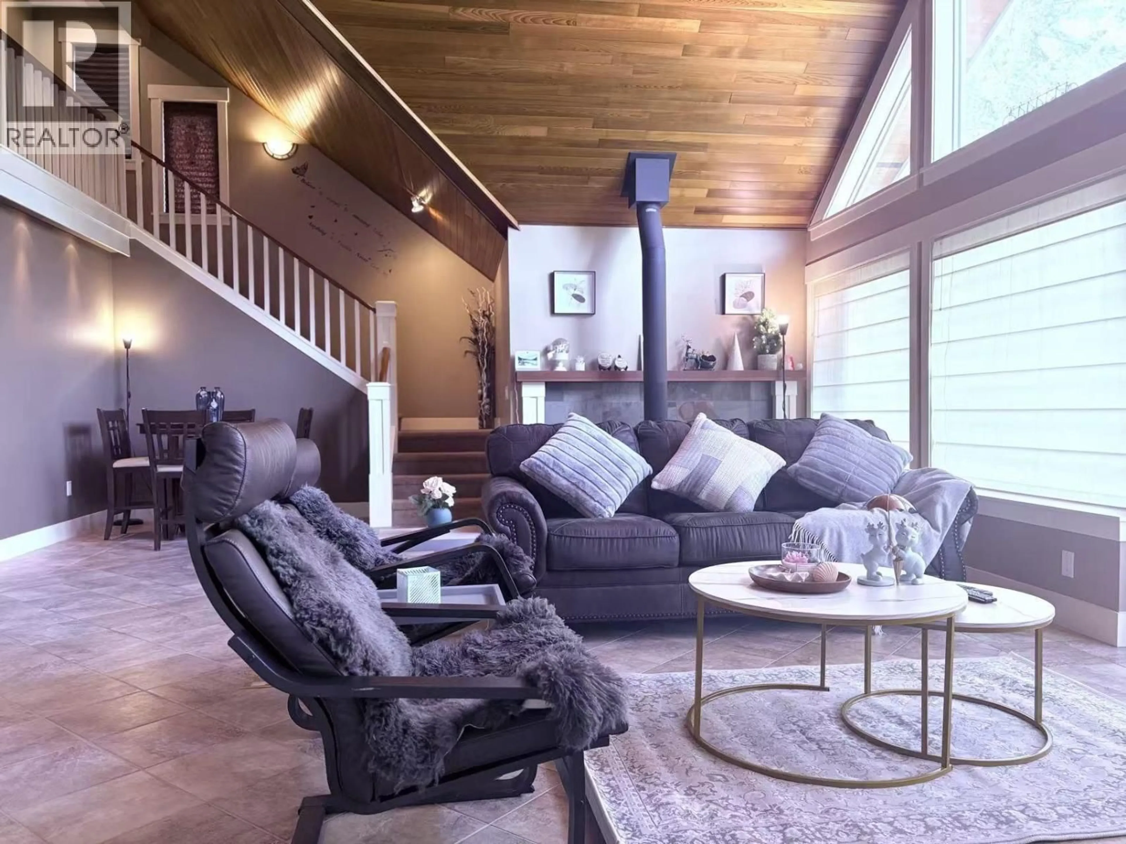 Living room with furniture, wood/laminate floor for 5393 SANS SOUCI ROAD, Halfmoon Bay British Columbia V7Z1B6