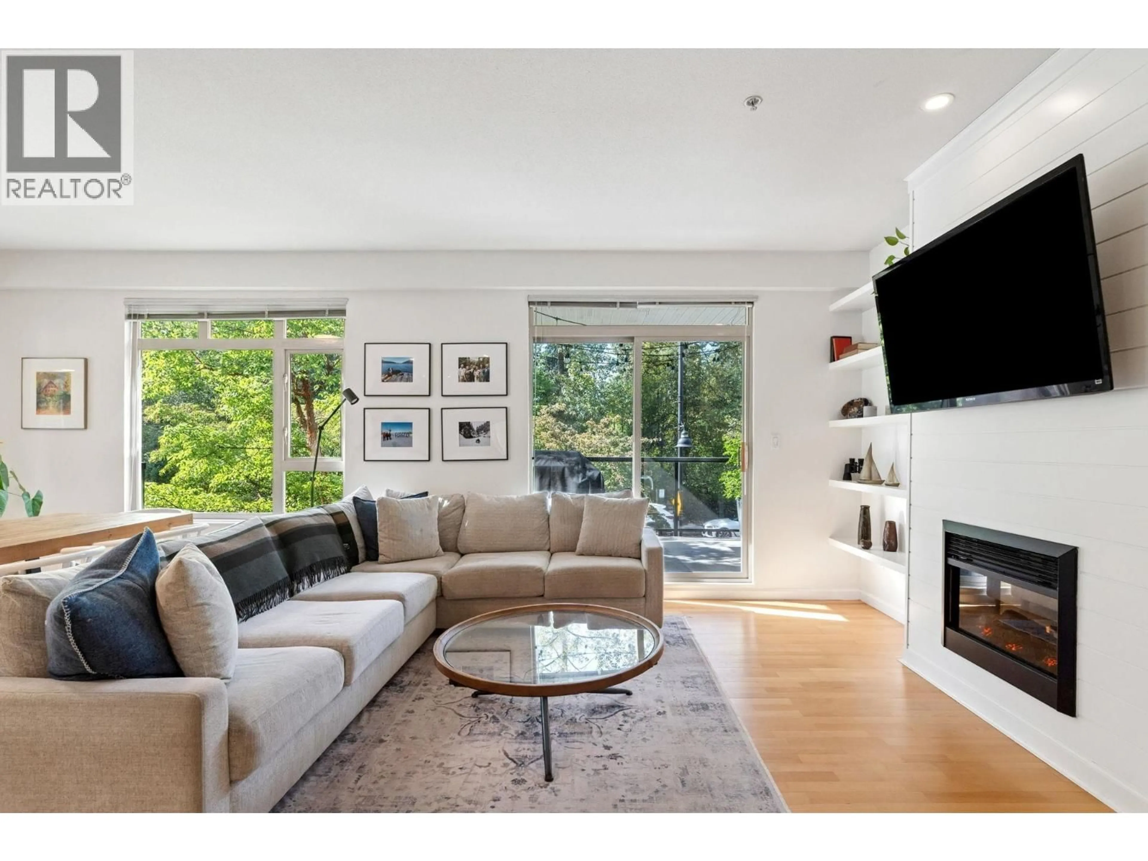 Living room with furniture, unknown for 219 - 100 CAPILANO ROAD, Port Moody British Columbia V3H5M9