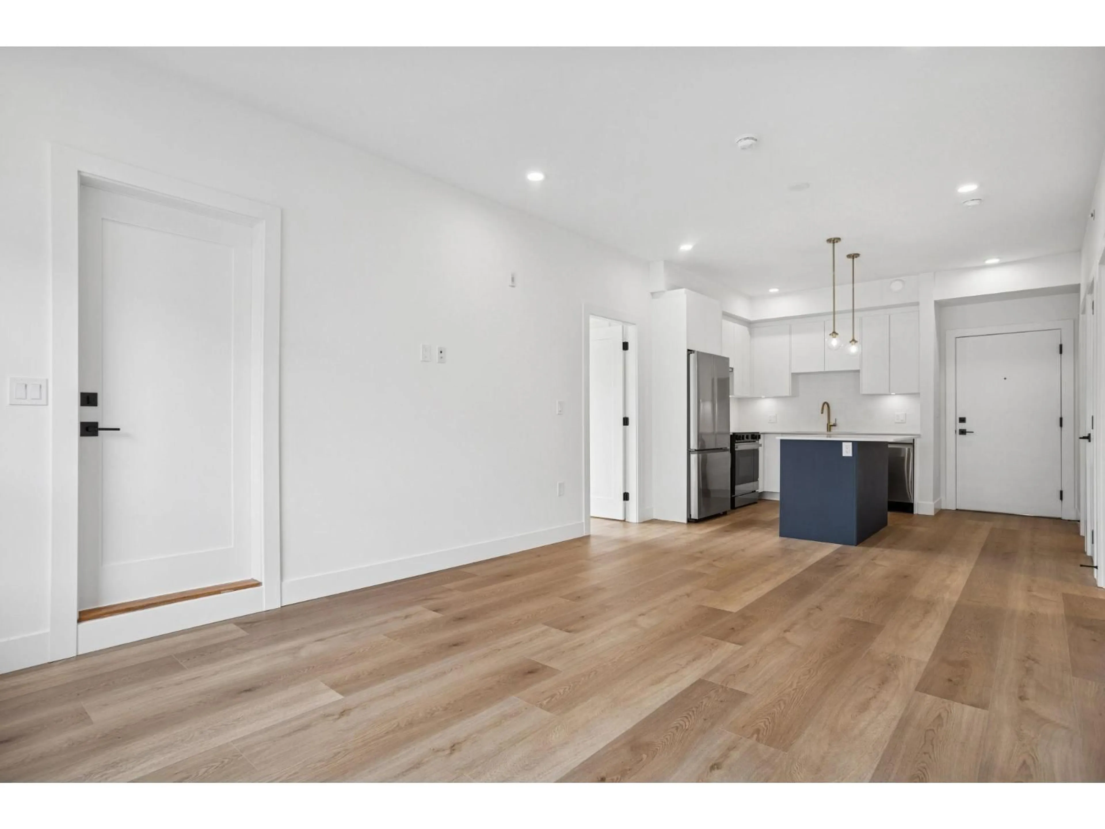 Open concept kitchen, wood/laminate floor for 208 - 20286 72B AVENUE, Langdale British Columbia V2Y1T2