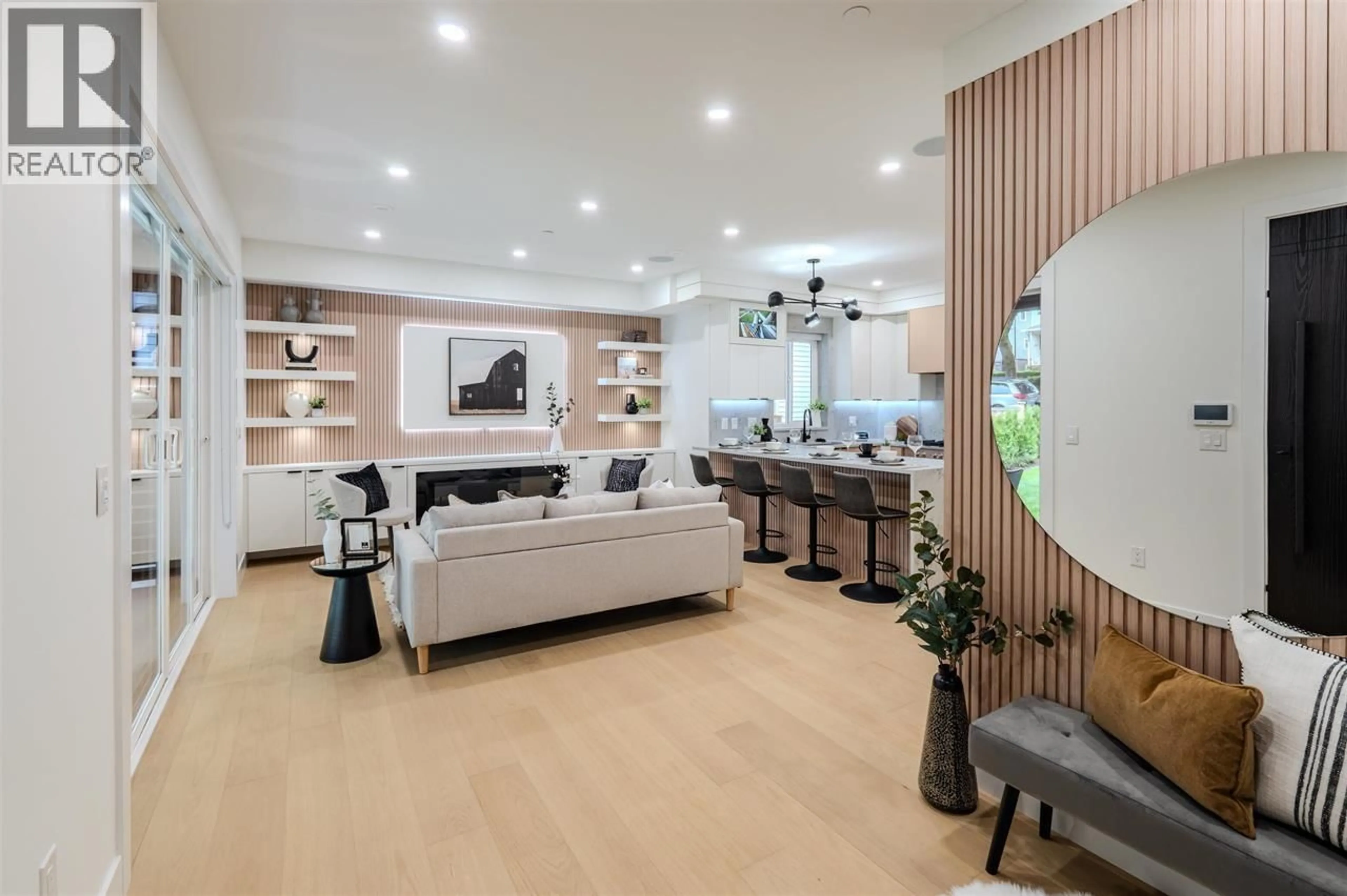 Living room with furniture, wood/laminate floor for 1 - 3576 PENDER STREET, Vancouver British Columbia V5K2E3