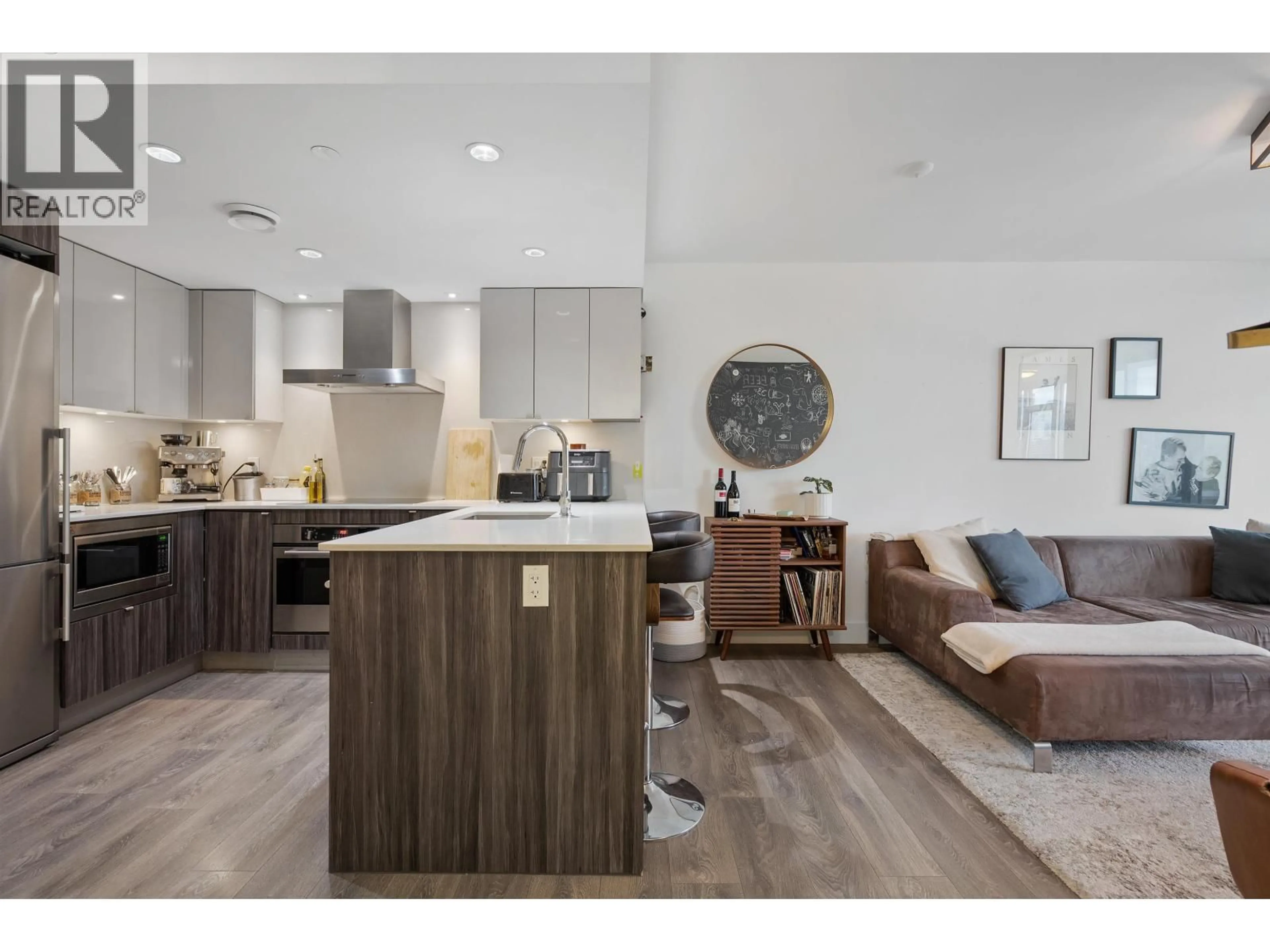 Open concept kitchen, wood/laminate floor for 1609 - 1788 COLUMBIA STREET, Vancouver British Columbia V5Y0L7