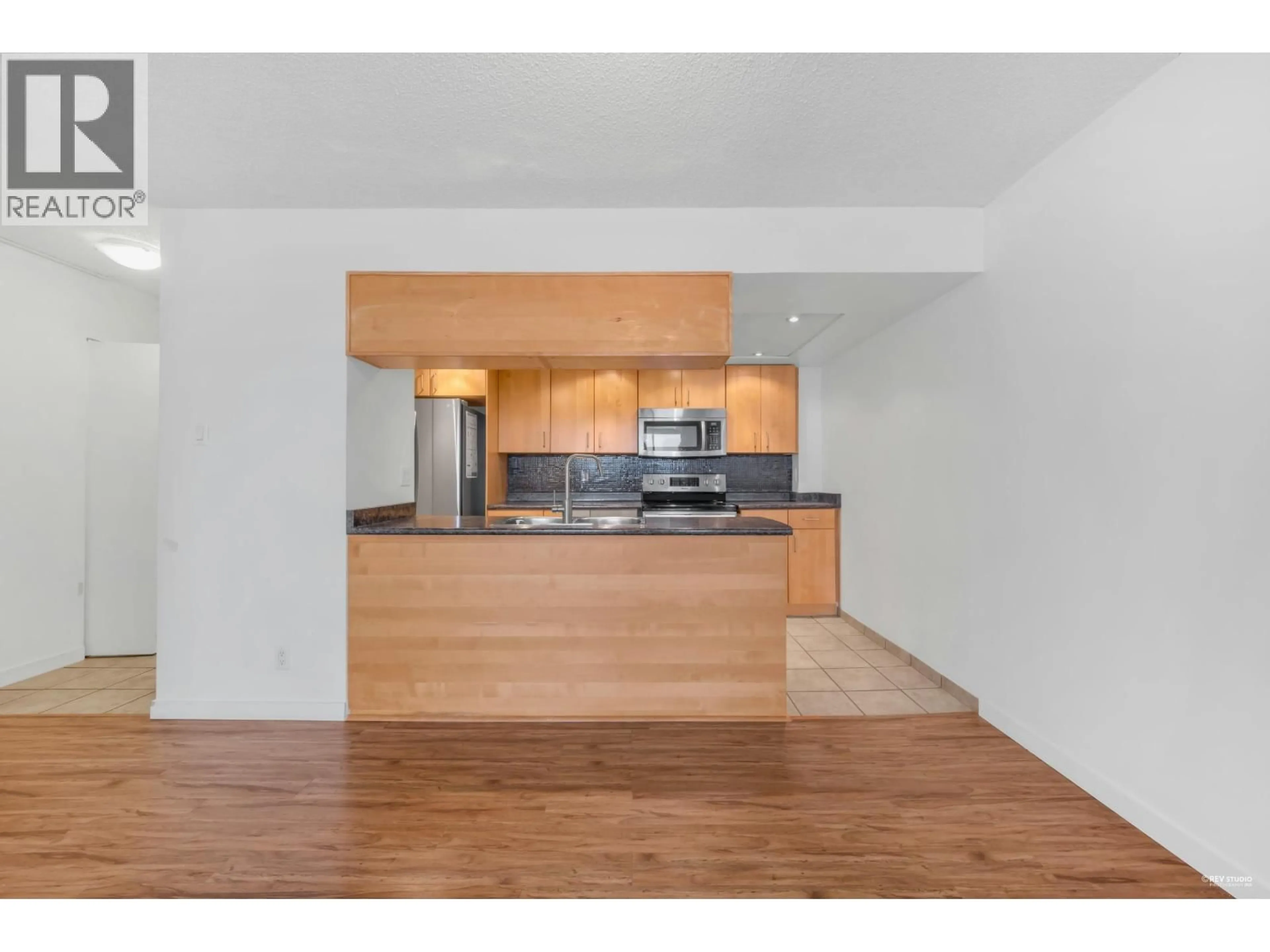 Open concept kitchen, wood/laminate floor for 2402 - 9521 CARDSTON COURT, Burnaby British Columbia V3N4R8