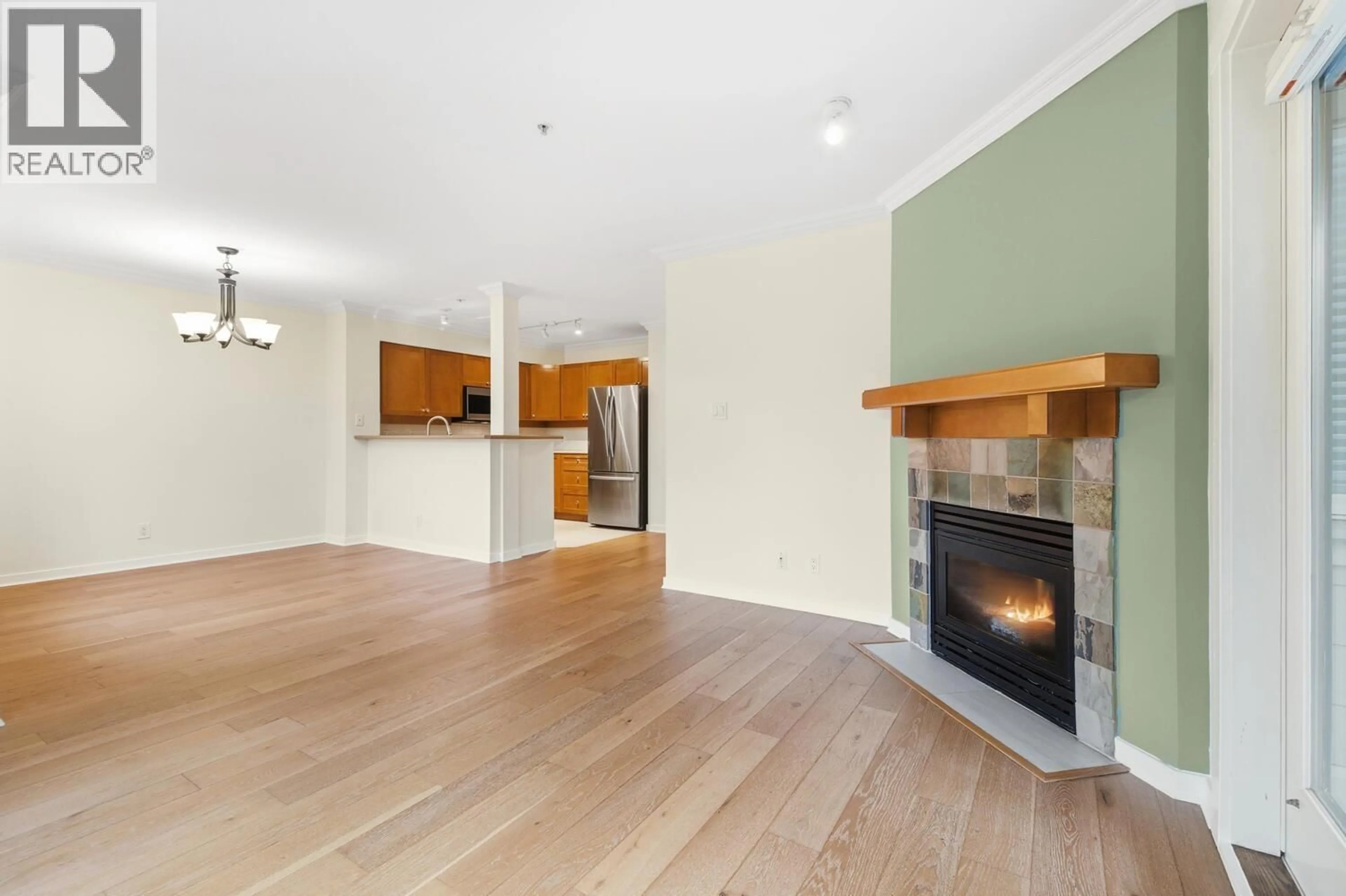 Open concept kitchen, wood/laminate floor for 205 - 18 SMOKEY SMITH PLACE, New Westminster British Columbia V3L5V3