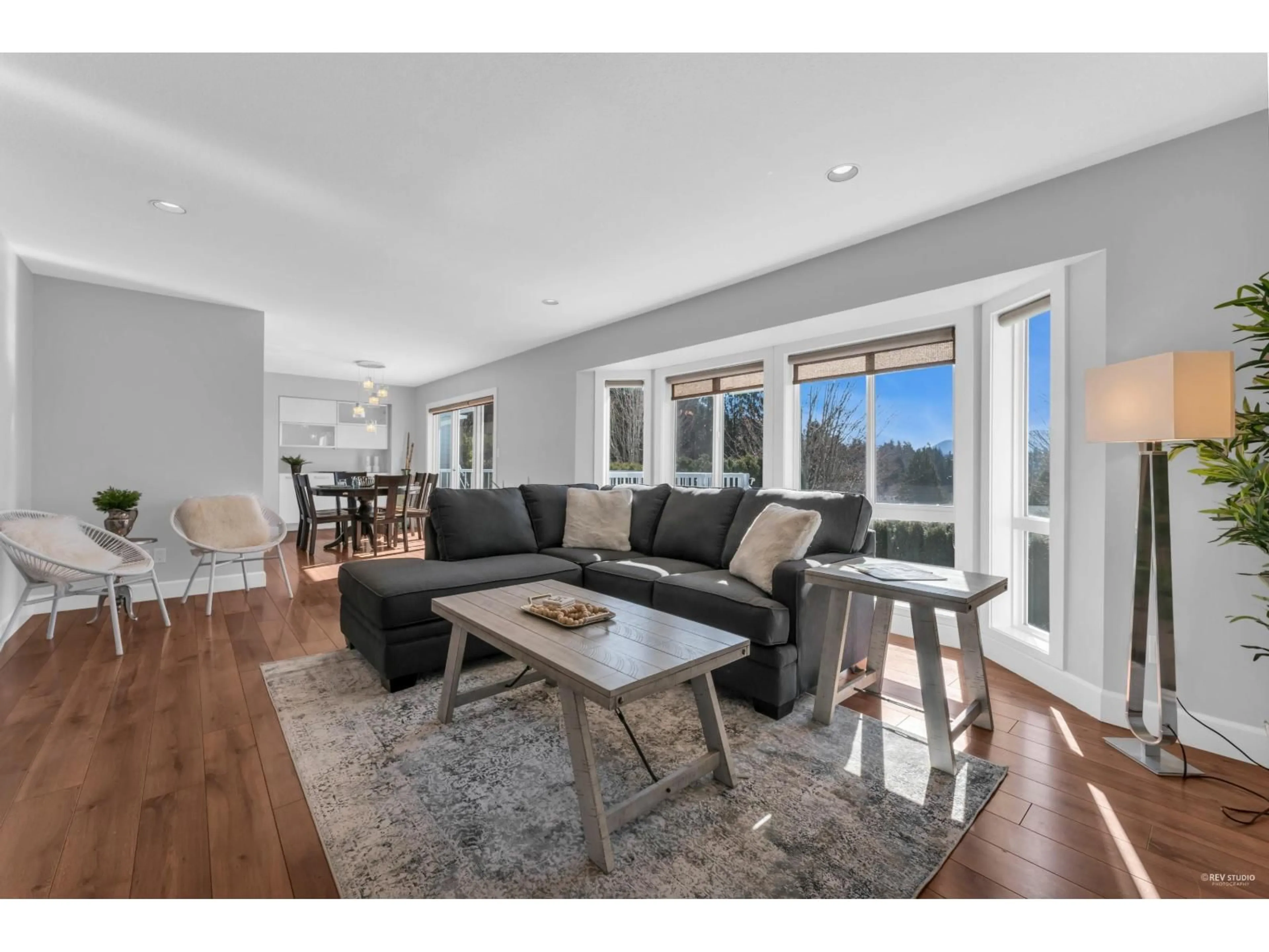 Living room with furniture, wood/laminate floor for 34860 GLENEAGLES PLACE, Abbotsford British Columbia V2S7G5