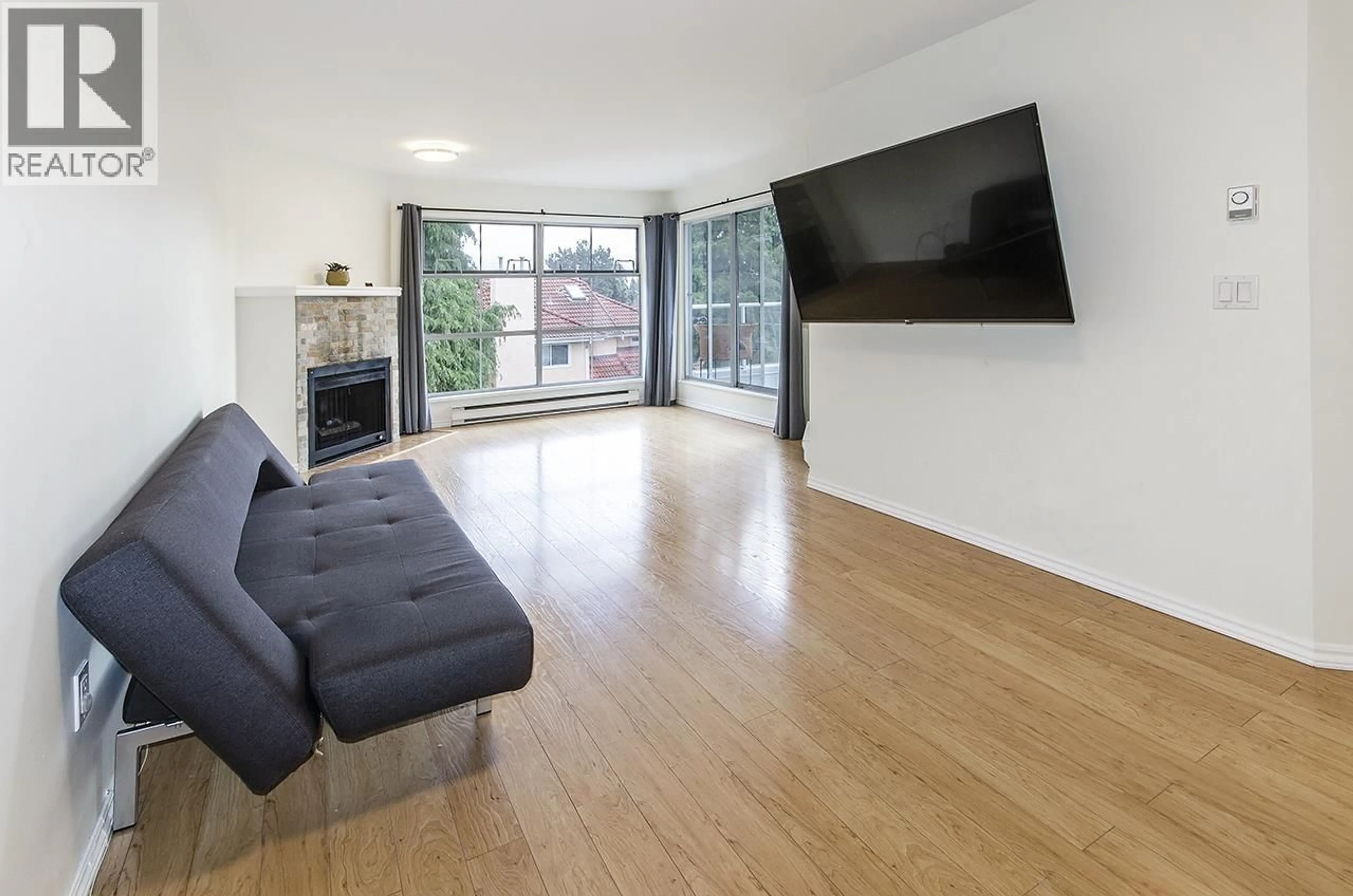 Living room with furniture, wood/laminate floor for 309 - 8611 GENERAL CURRIE ROAD, Richmond British Columbia V6Y3W4