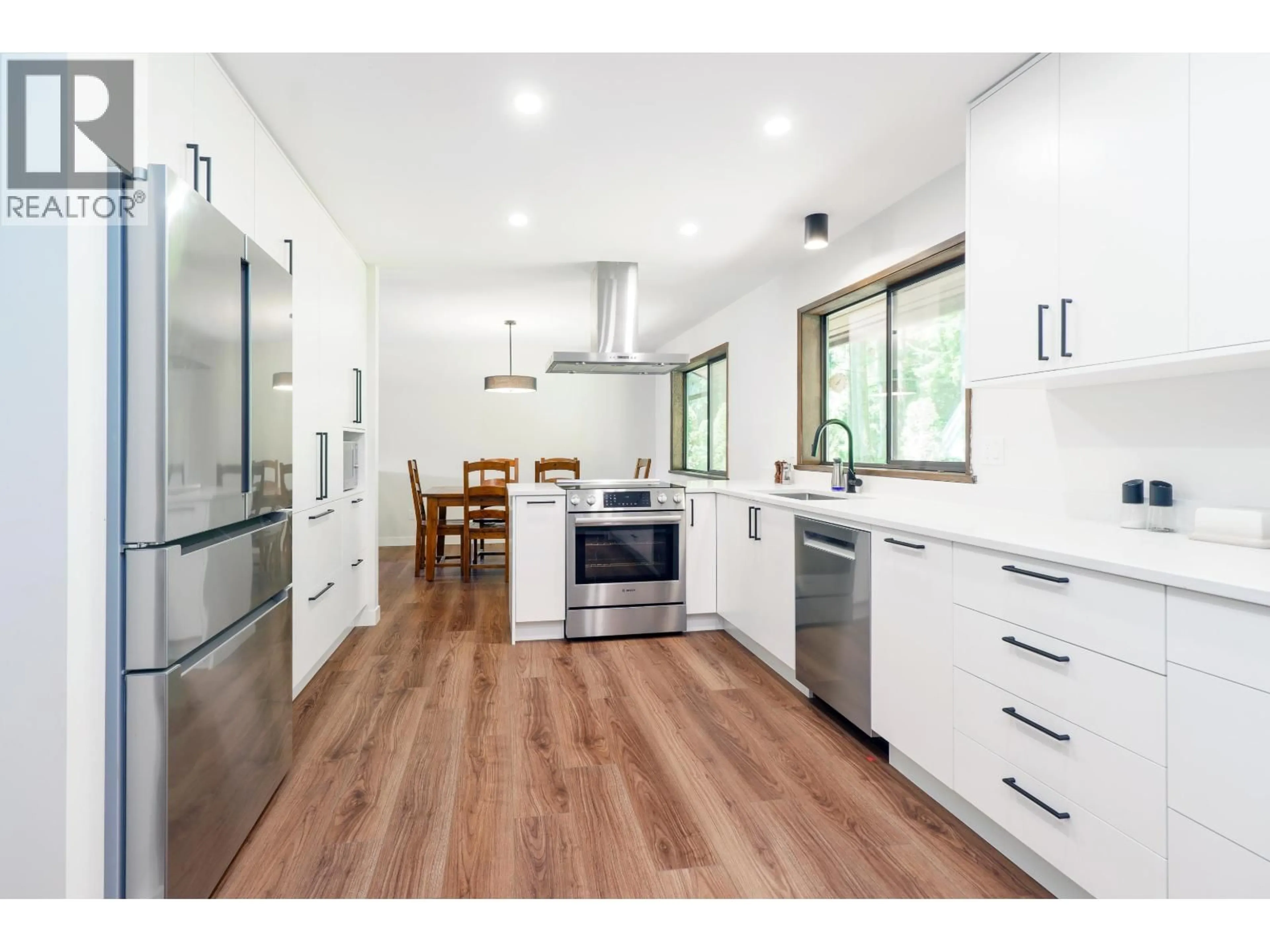 Open concept kitchen, wood/laminate floor for 27573 SAYERS CRESCENT, Maple Ridge British Columbia V2W1N3