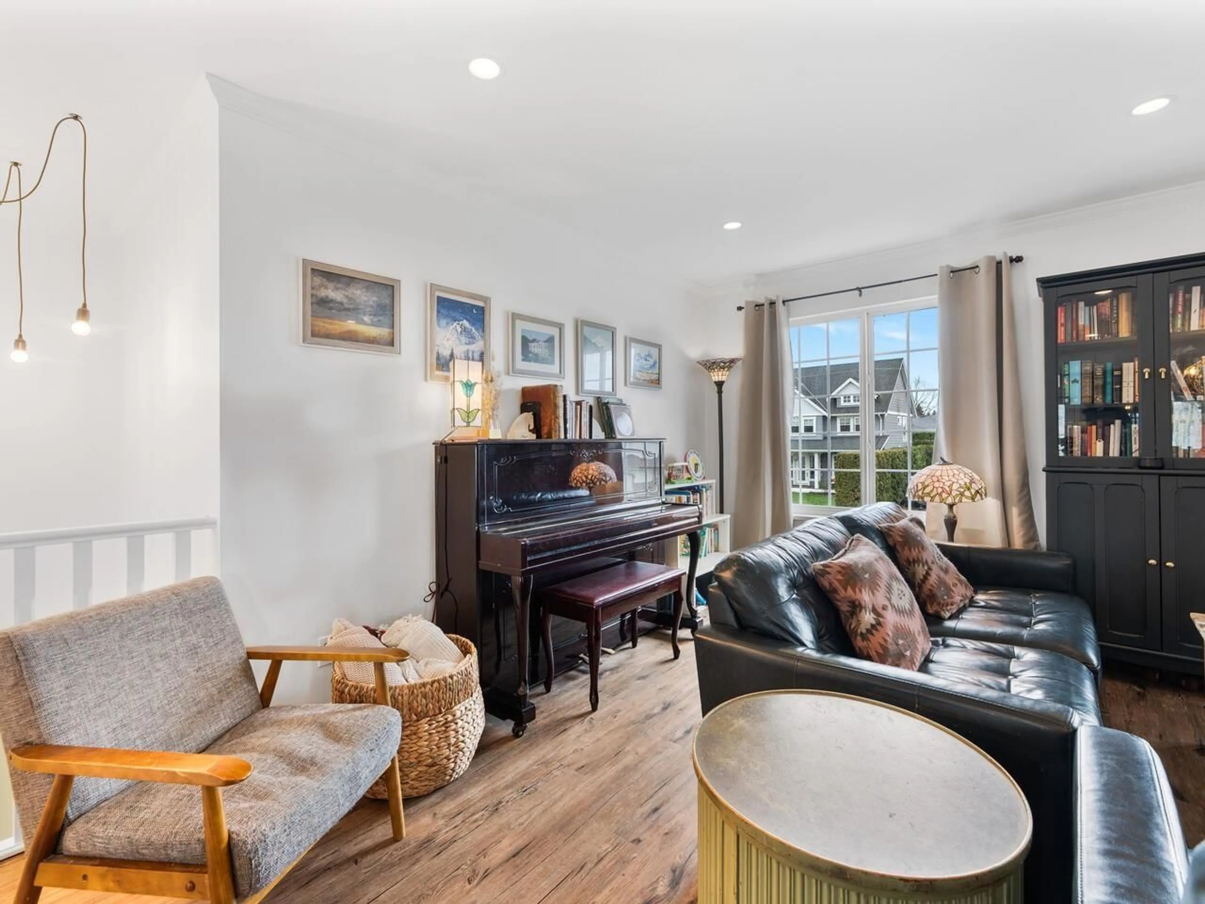 Living room with furniture, wood/laminate floor for 5020 215 STREET, Langley British Columbia V3A6C6