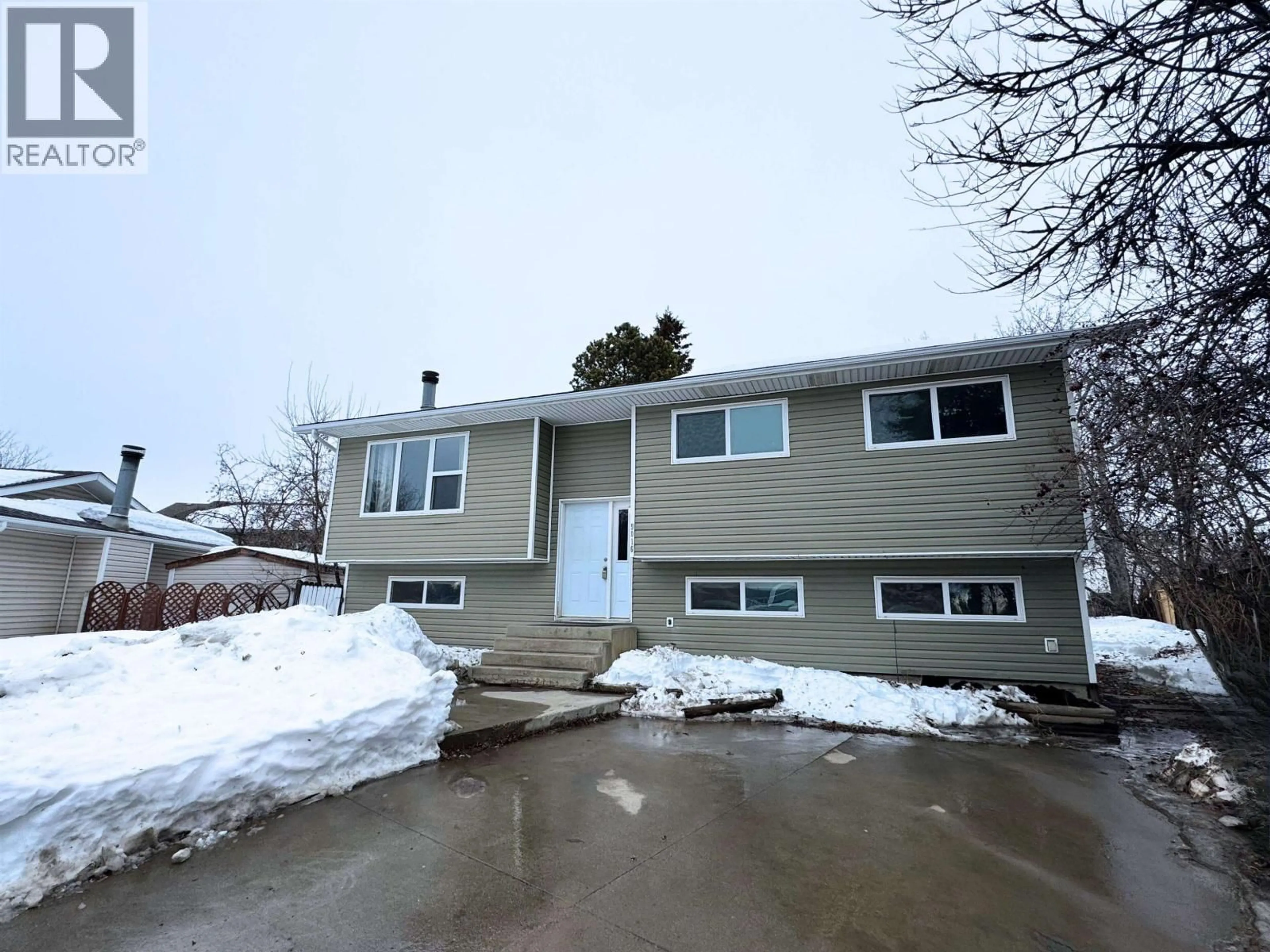 Home with vinyl exterior material, street for 9016 98A AVENUE, Fort St. John British Columbia V1J5E4