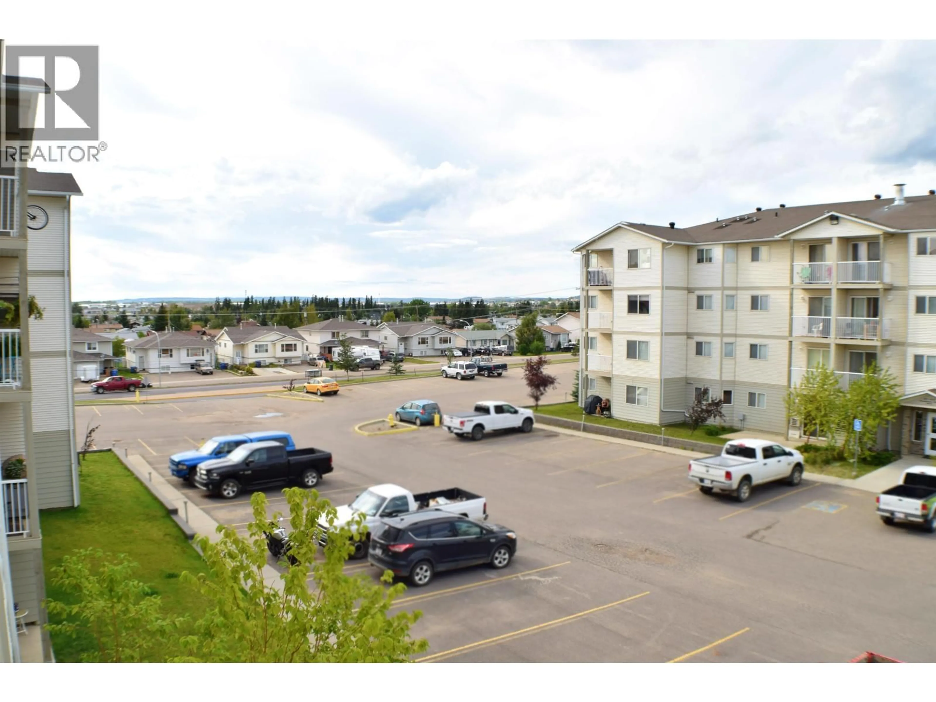 A pic from outside/outdoor area/front of a property/back of a property/a pic from drone, unknown for 308 - 8507 86 STREET, Fort St. John British Columbia V1J0E4