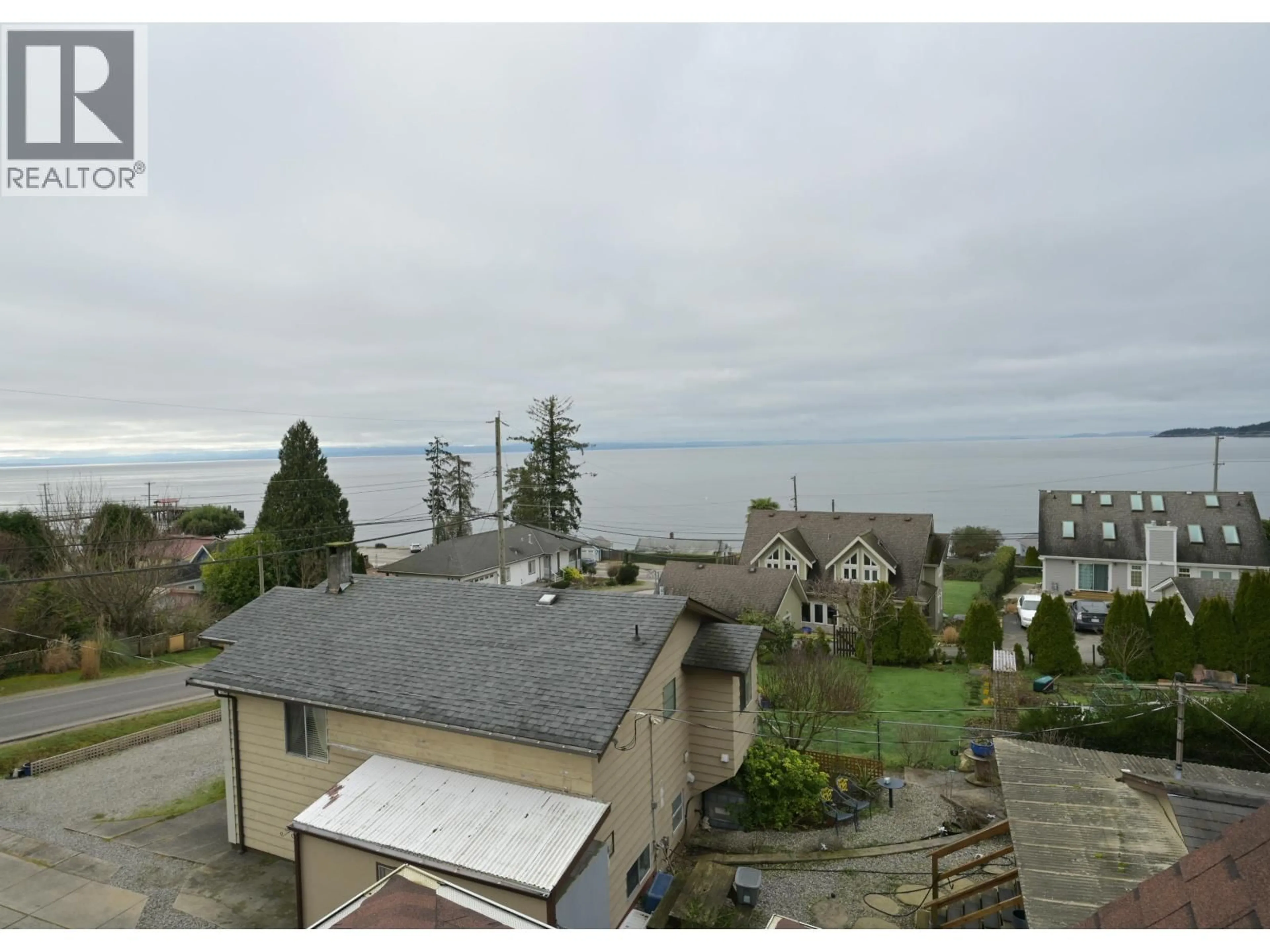A pic from outside/outdoor area/front of a property/back of a property/a pic from drone, water/lake/river/ocean view for 5160 BAY ROAD, Sechelt British Columbia V7Z0G3
