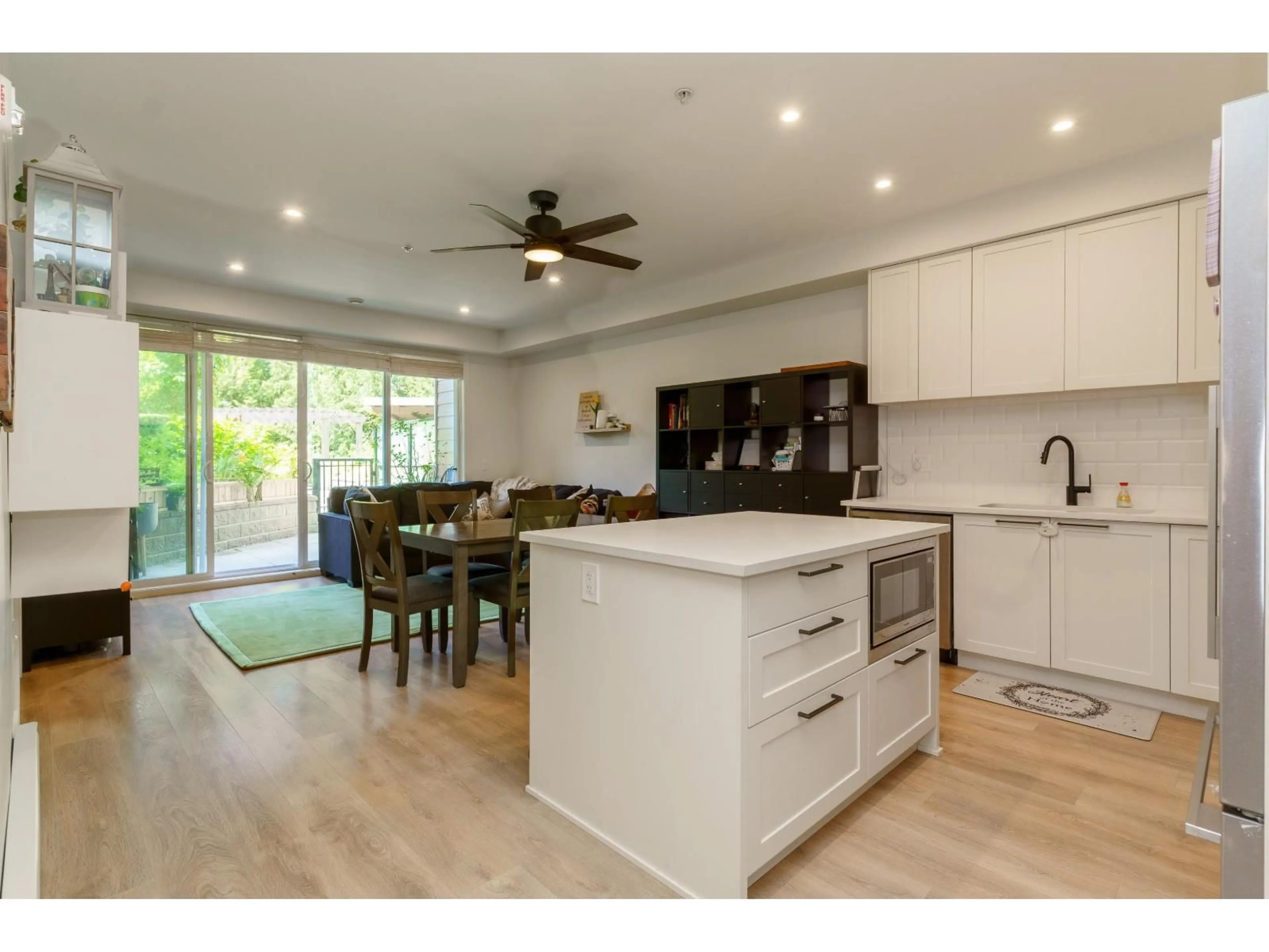 Open concept kitchen, wood/laminate floor for 119 - 5415 BRYDON CRESCENT, Langley British Columbia V3A0N4