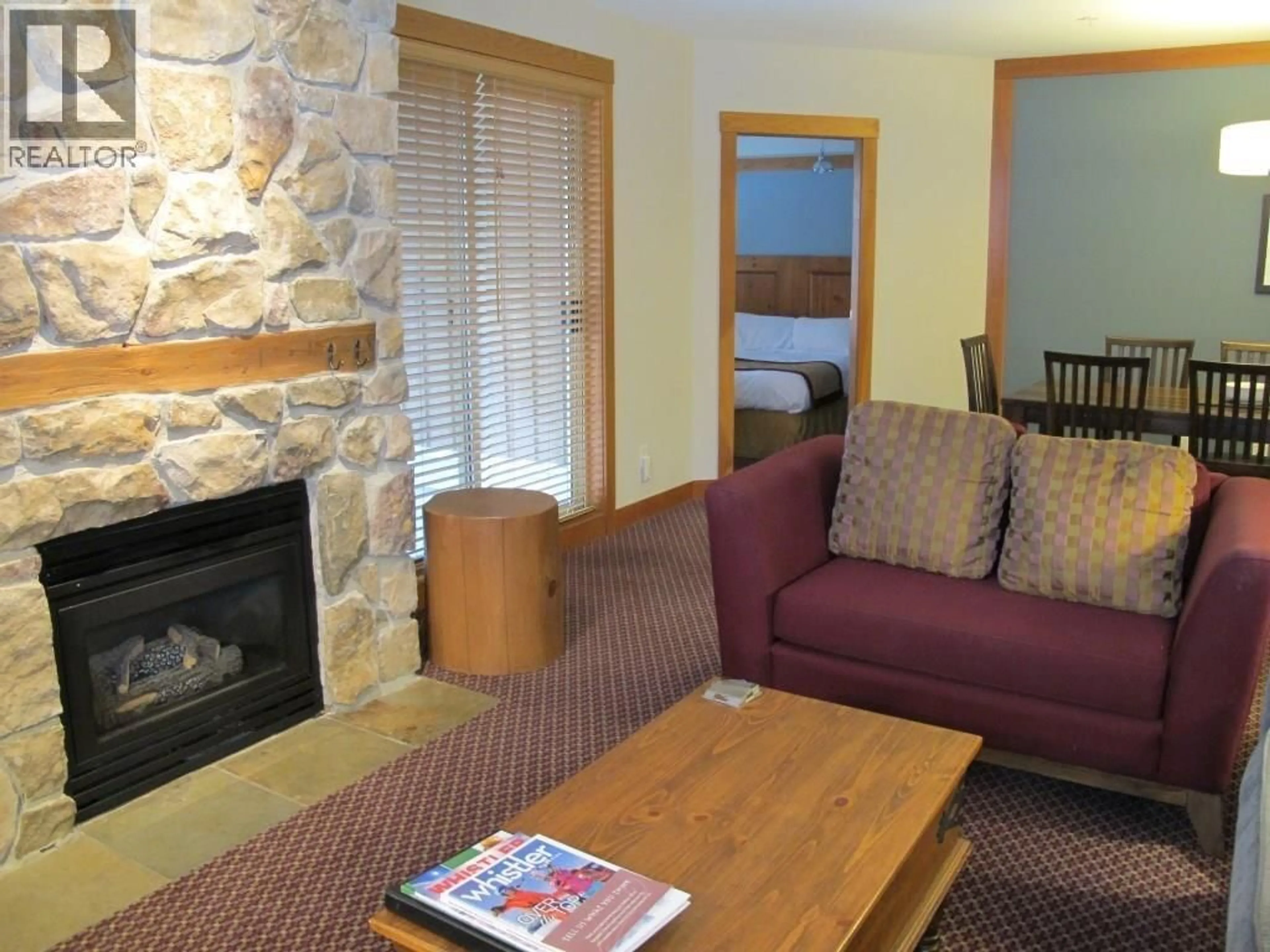 Living room with furniture, wood/laminate floor for 201D - 2036 LONDON LANE, Whistler British Columbia V8E0N7