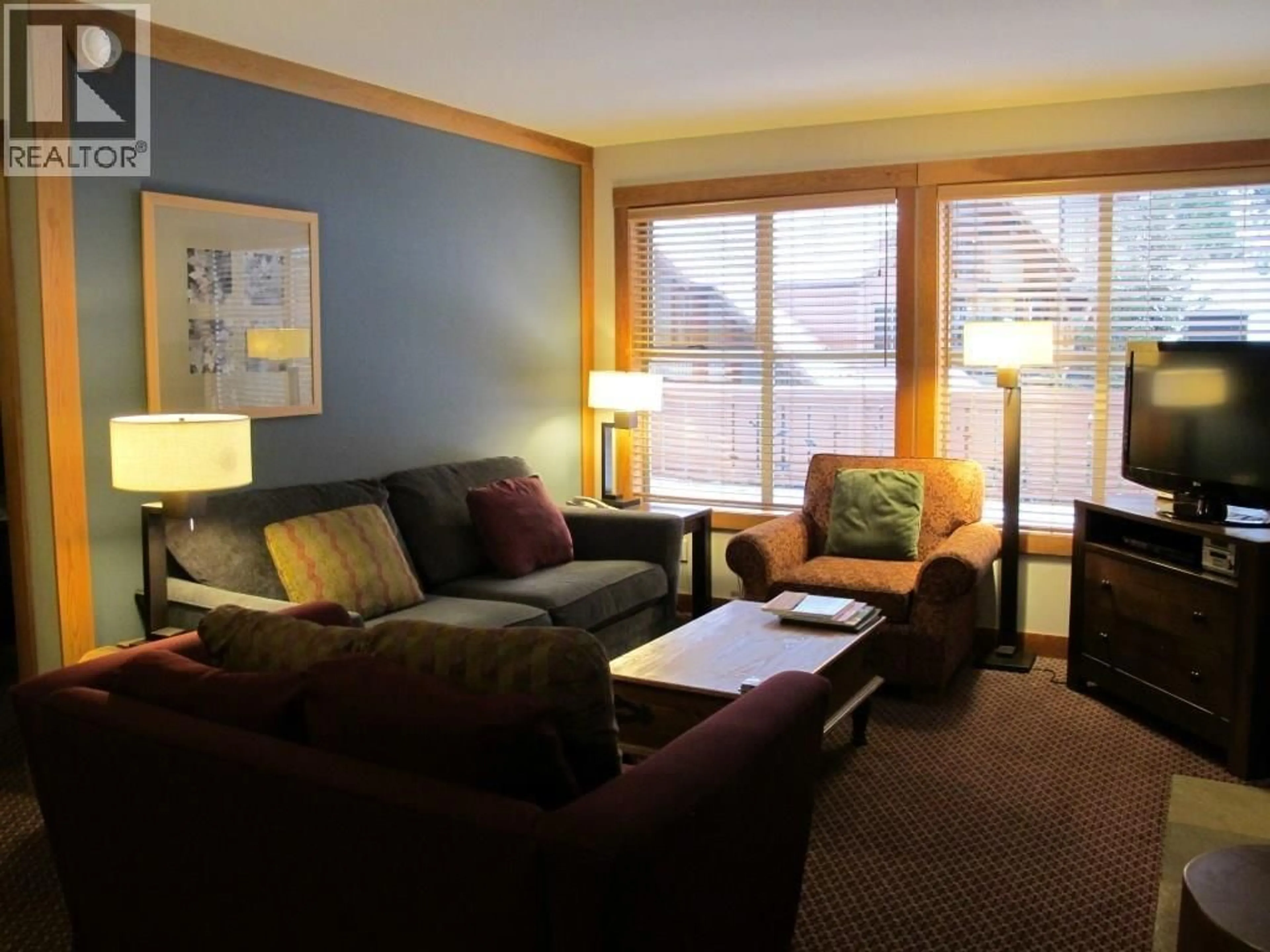 Living room with furniture, wood/laminate floor for 201D - 2036 LONDON LANE, Whistler British Columbia V8E0N7